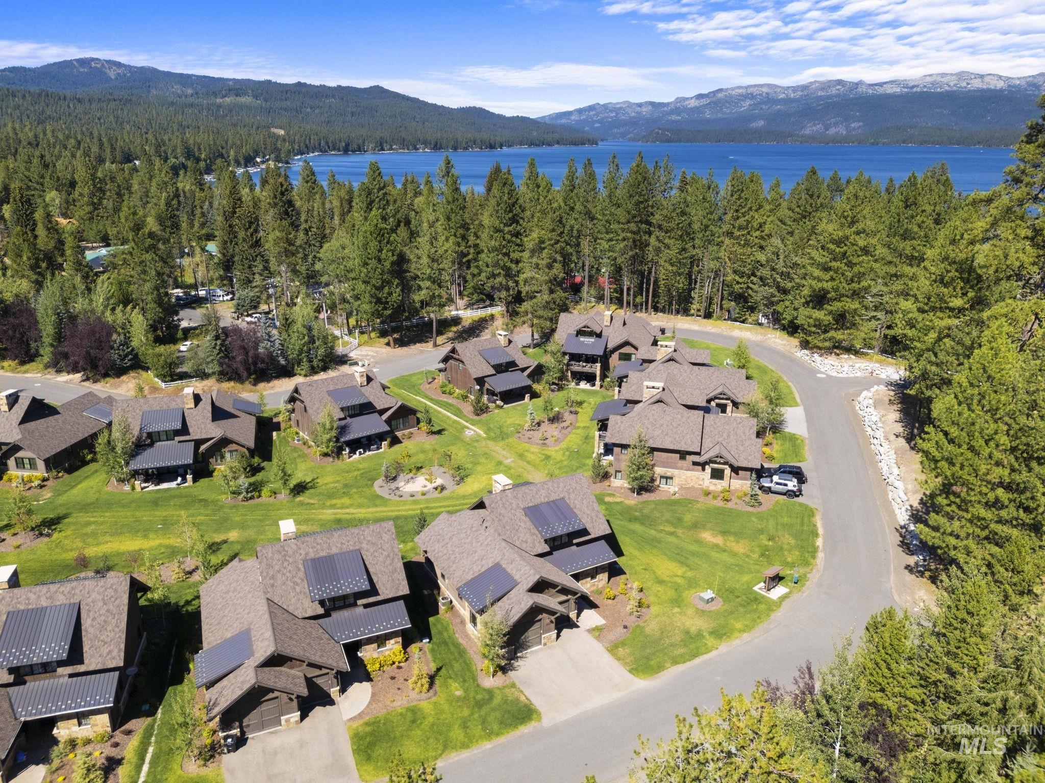 View of property location featuring nearby suburban area and a water and mountain view