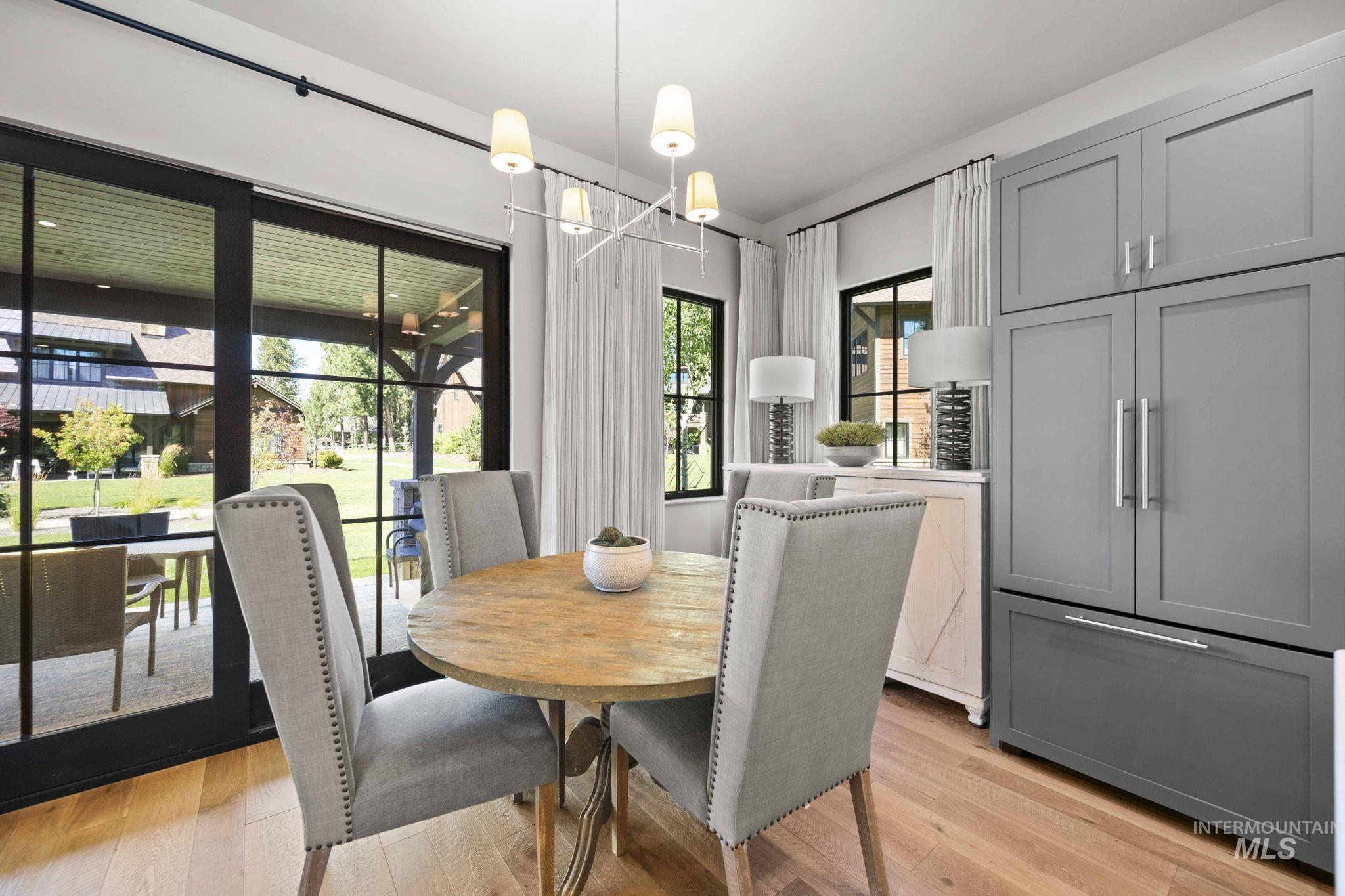 Dining area with a chandelier and light wood finished floors
