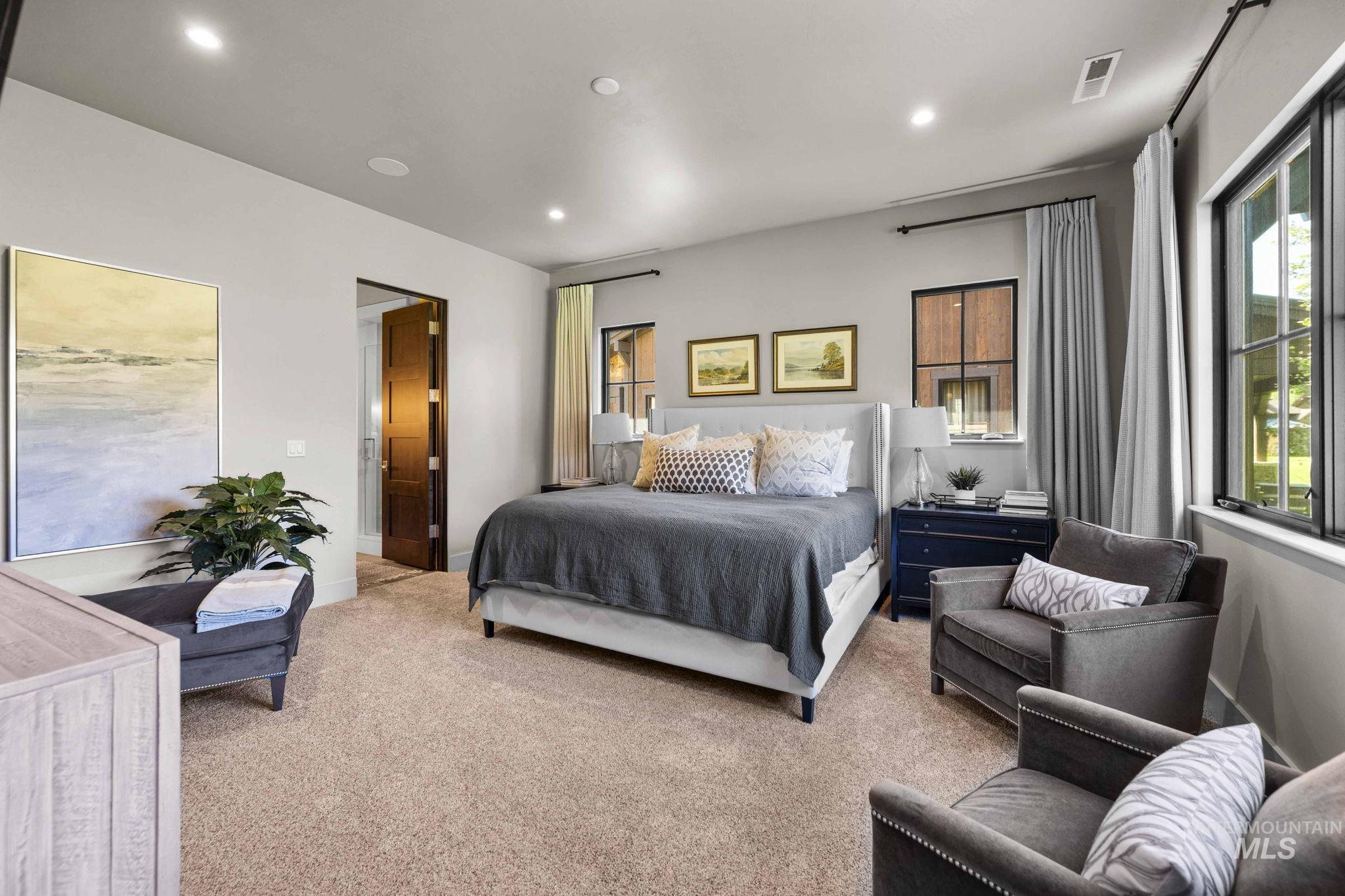 Carpeted bedroom with recessed lighting and baseboards