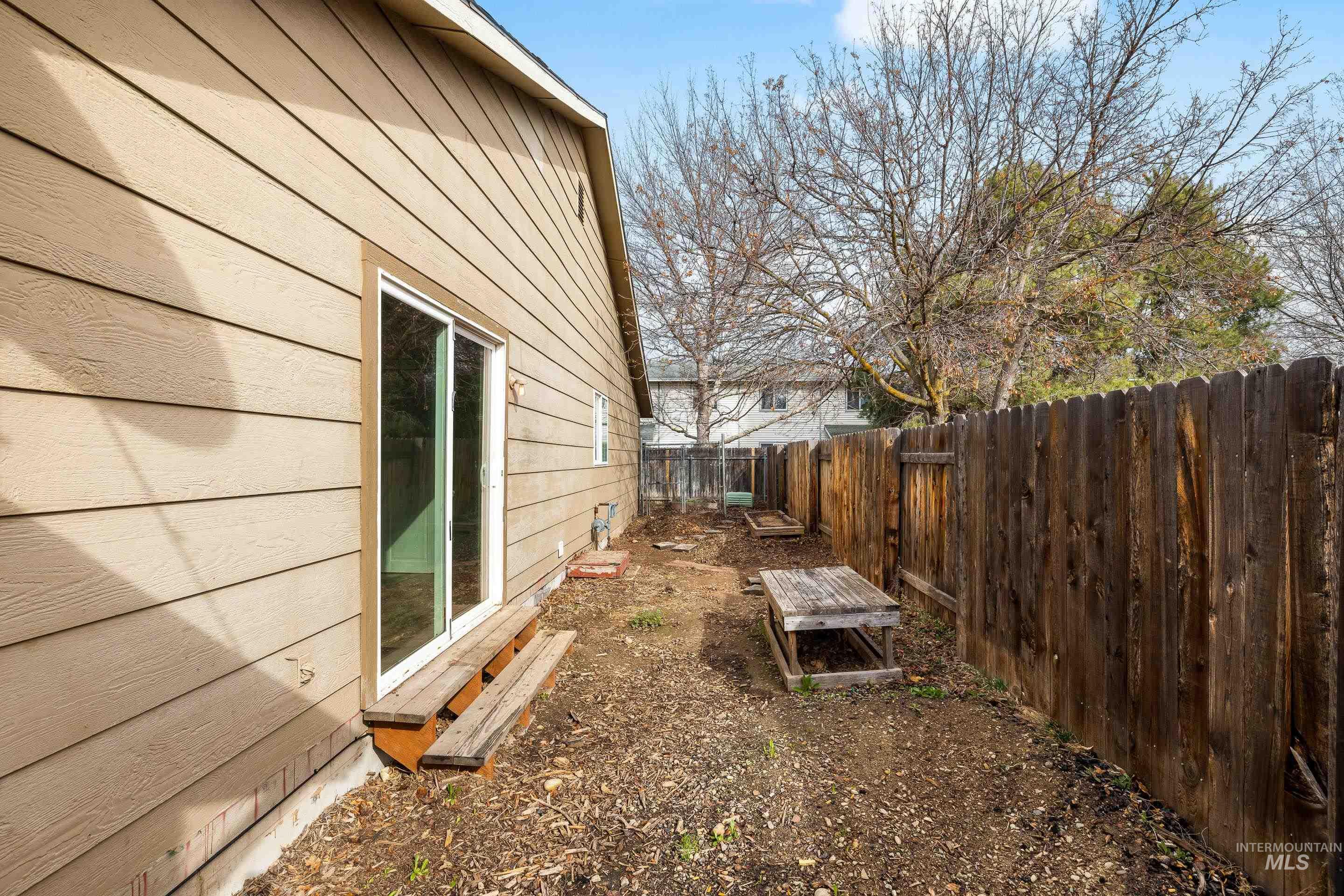View of fenced backyard