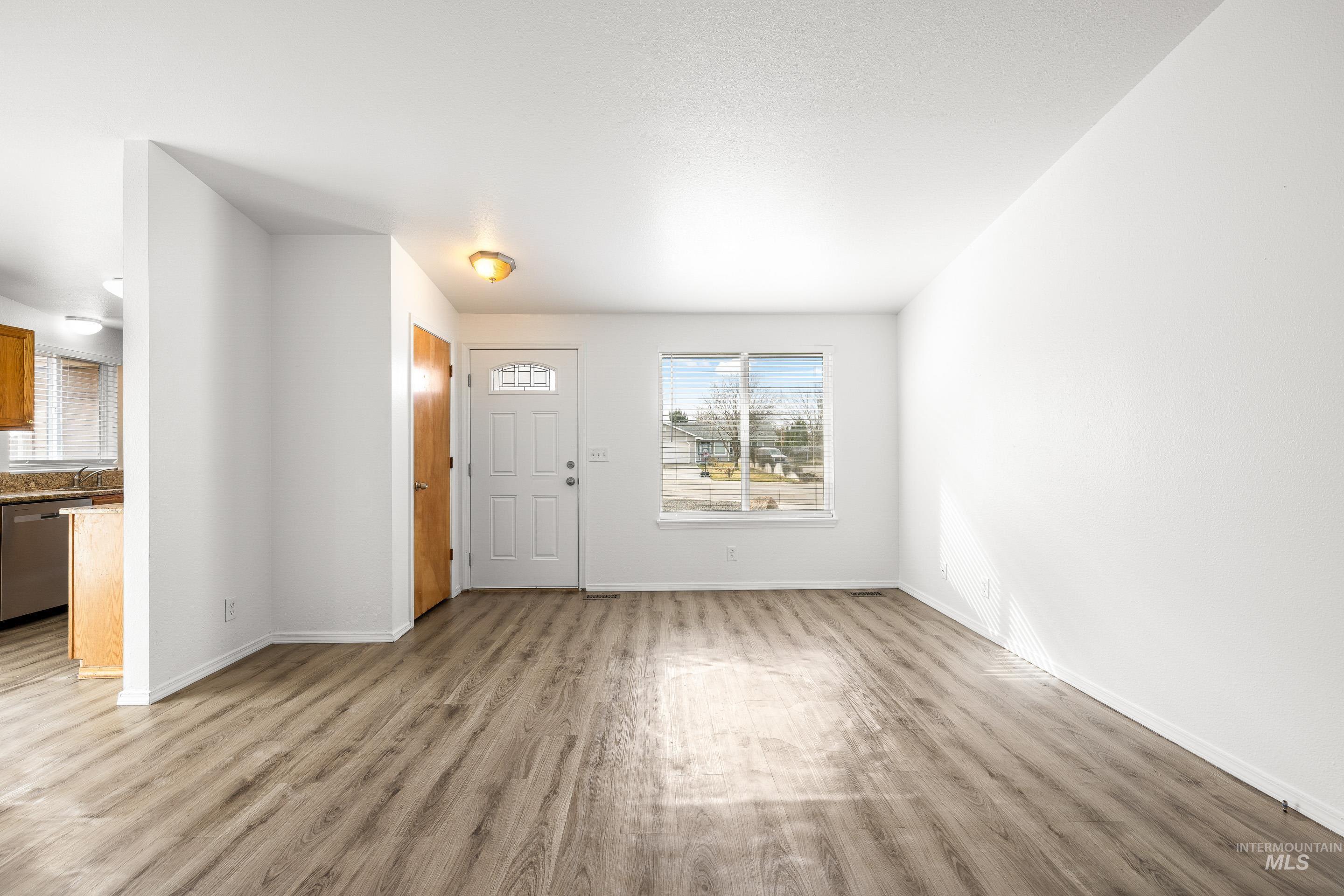 Foyer with light wood finished floors