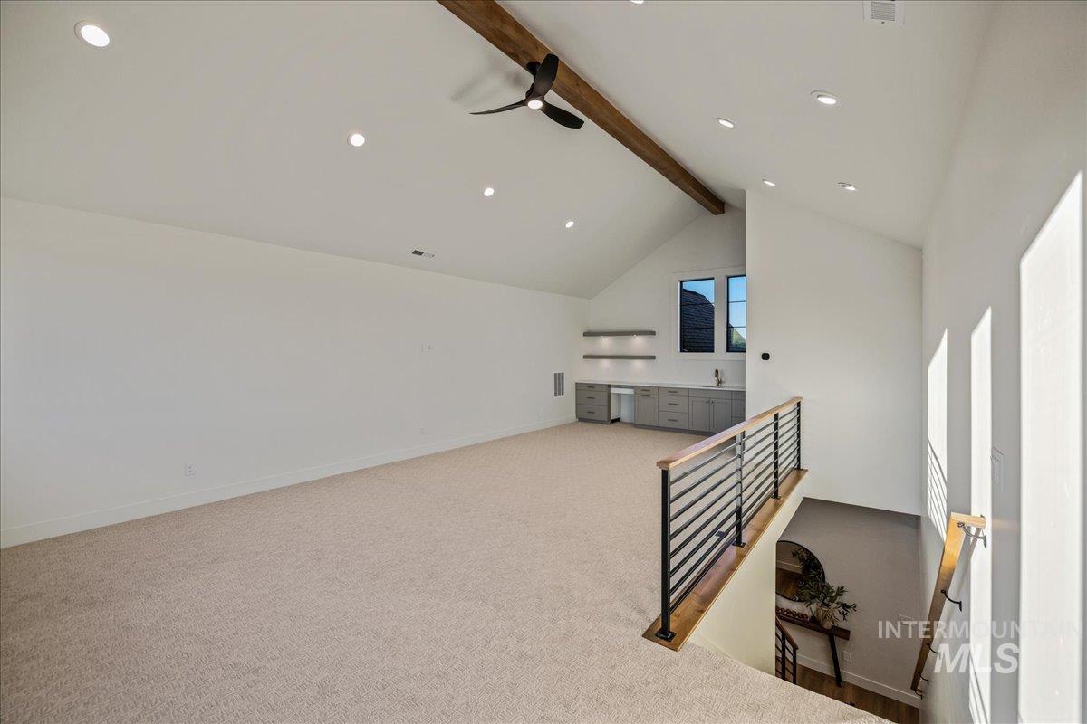 Bonus room featuring light carpet, recessed lighting, and a ceiling fan