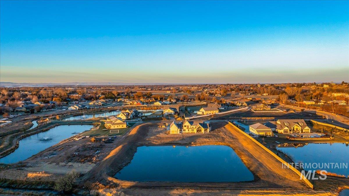 Aerial overview of property's location with a nearby body of water