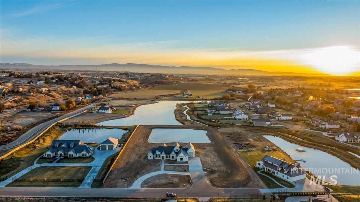 View of property location featuring nearby suburban area and a nearby body of water
