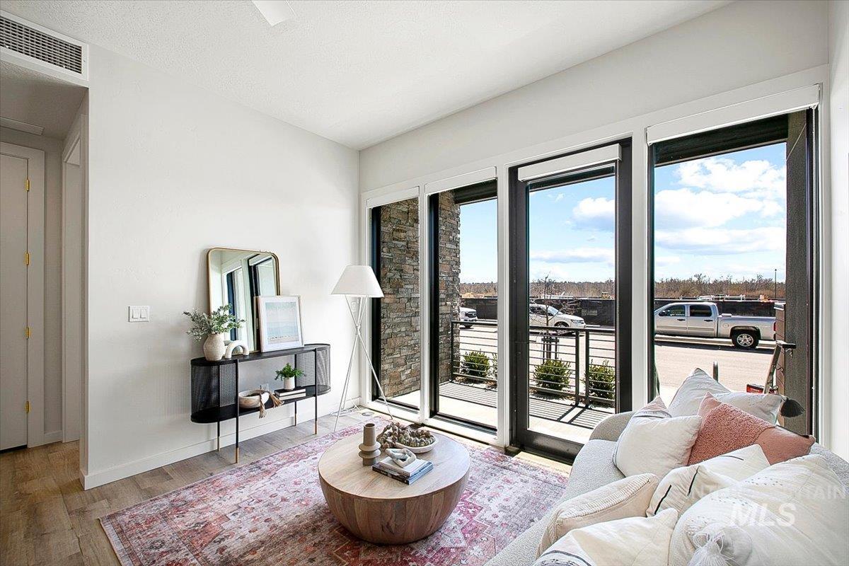 Living room with wood finished floors and baseboards