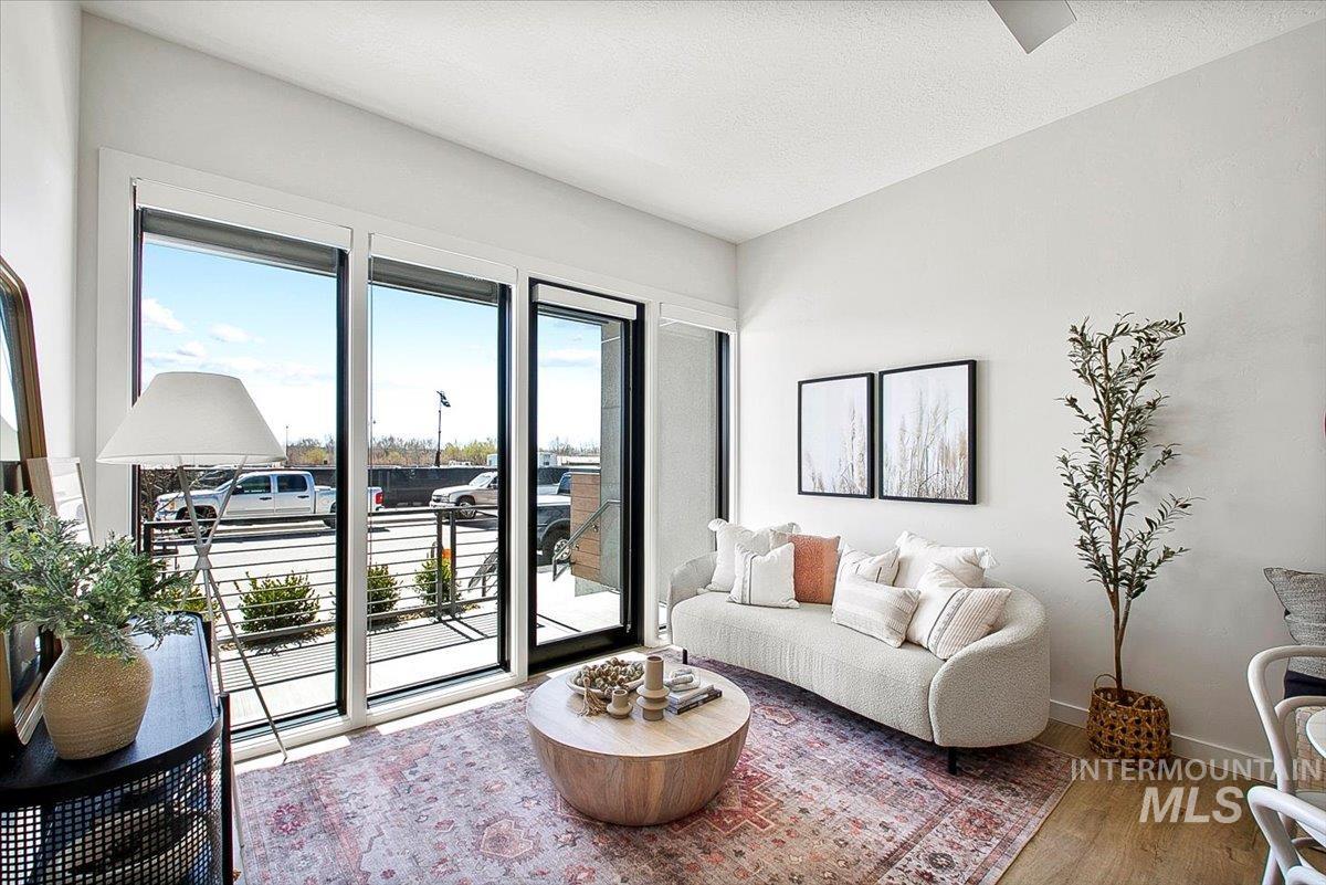 Living area featuring wood finished floors and a textured ceiling