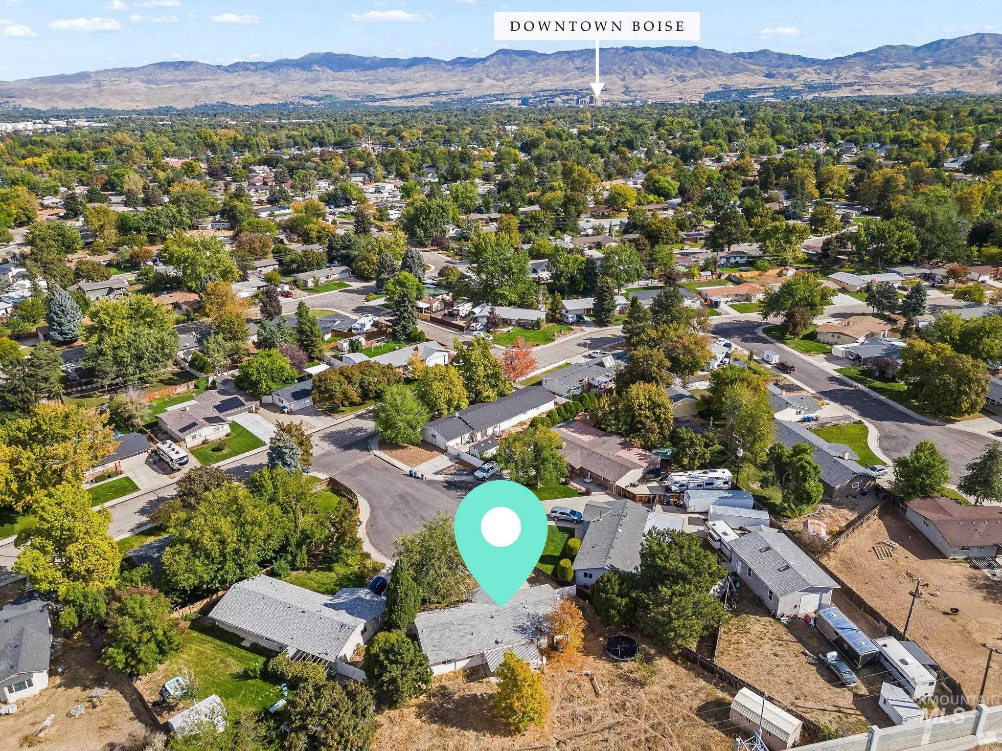 Aerial view of residential area with a mountain backdrop