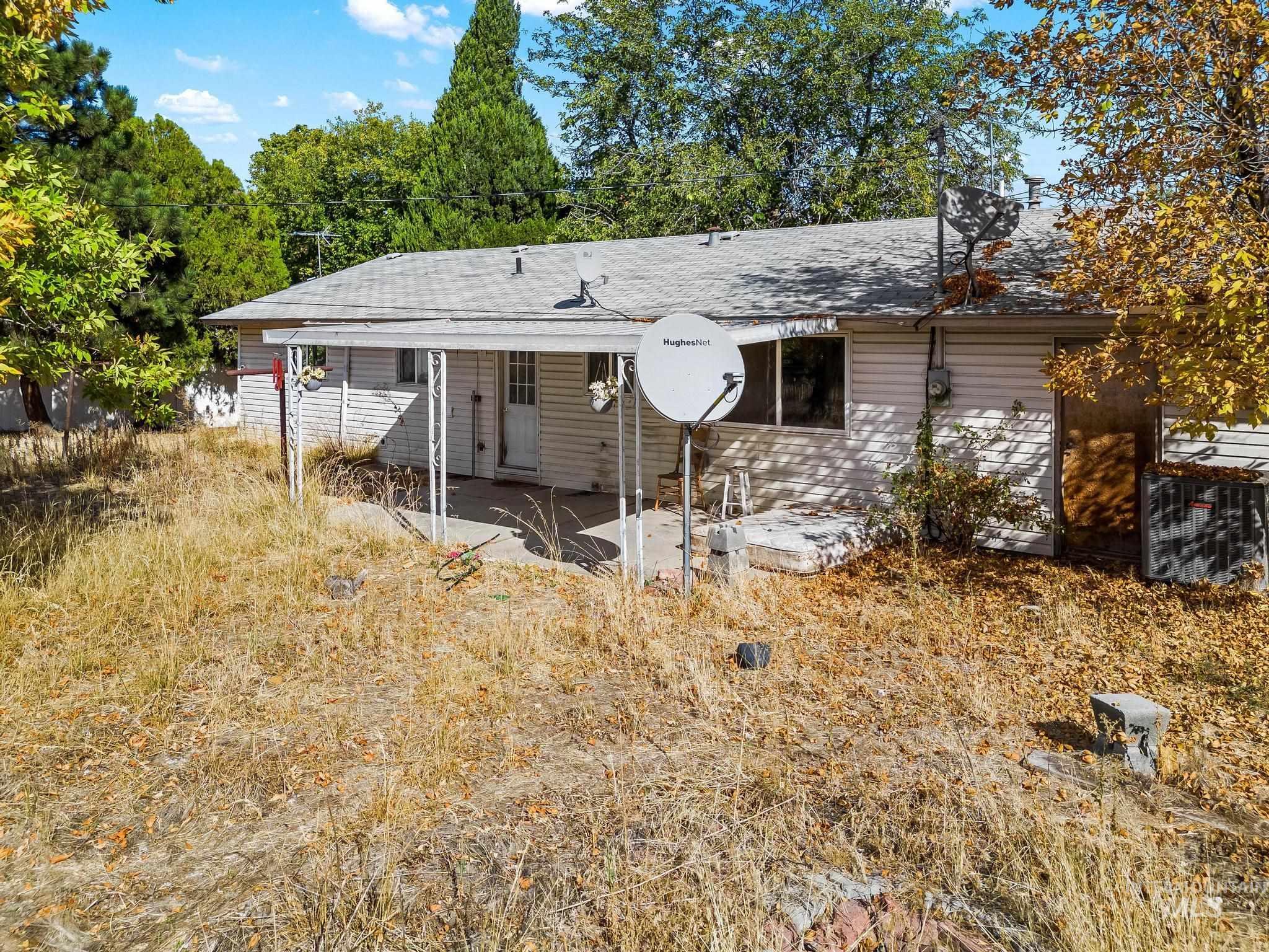 Rear view of house featuring a patio area