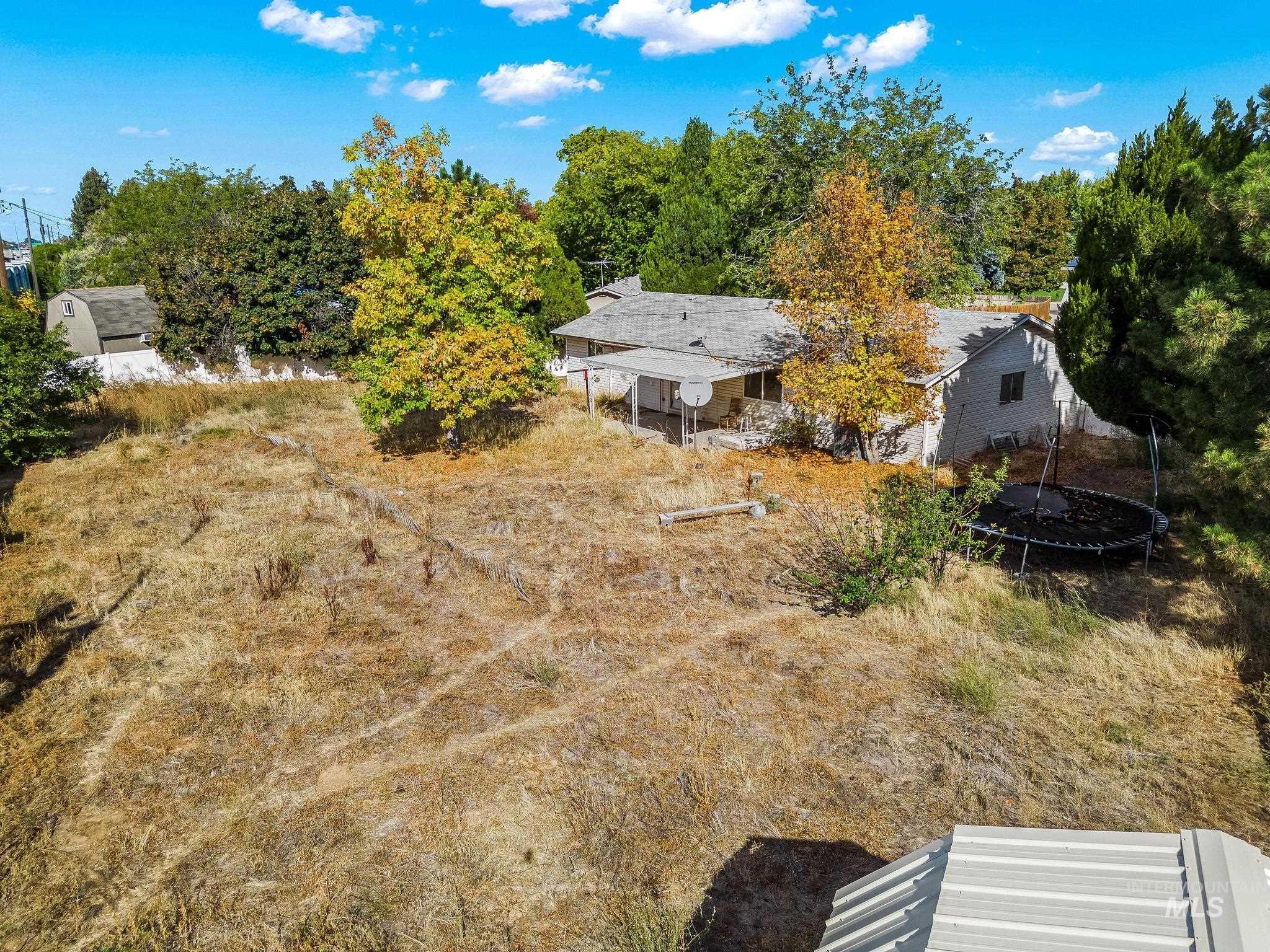 View of yard featuring a trampoline