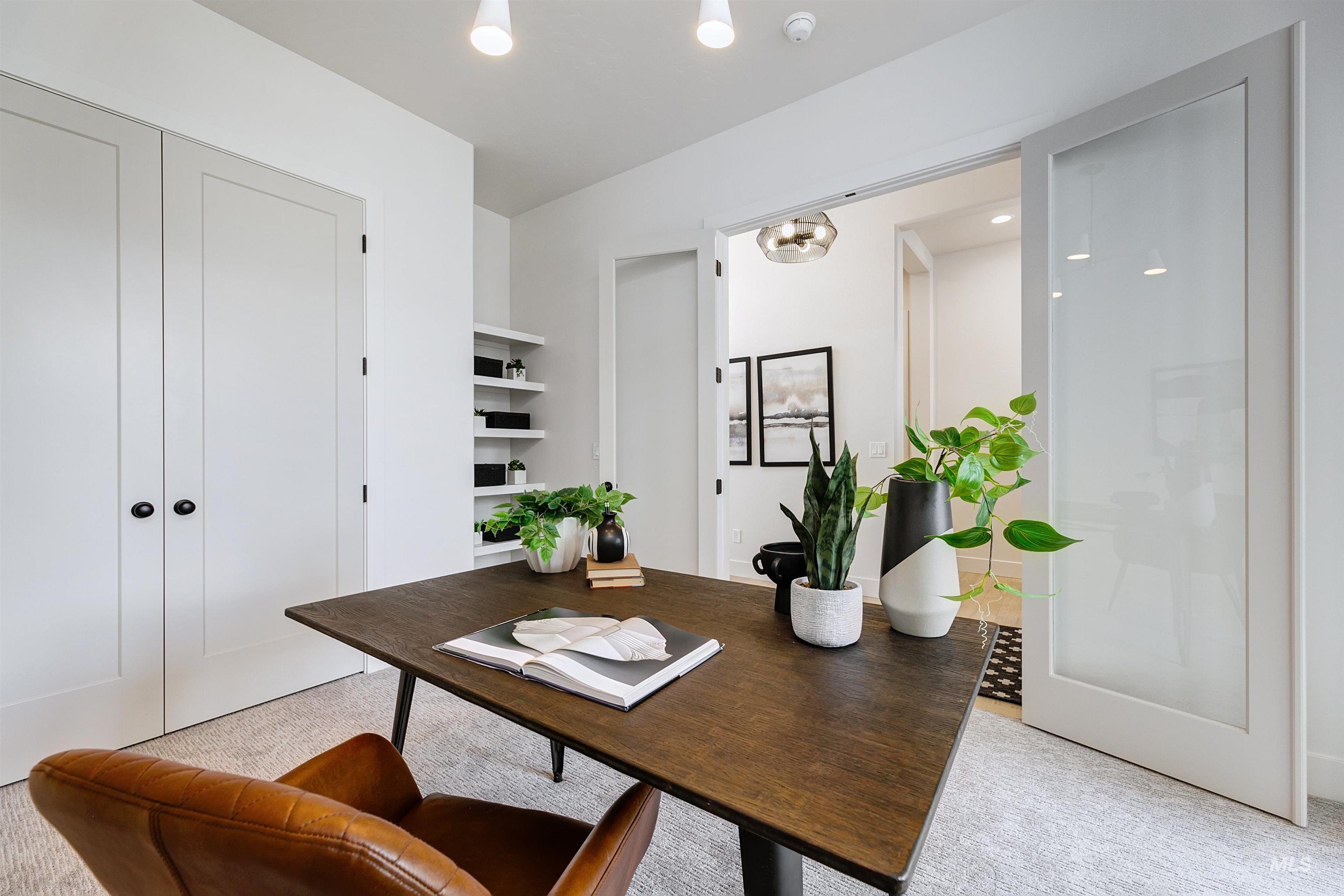 Home office with light colored carpet