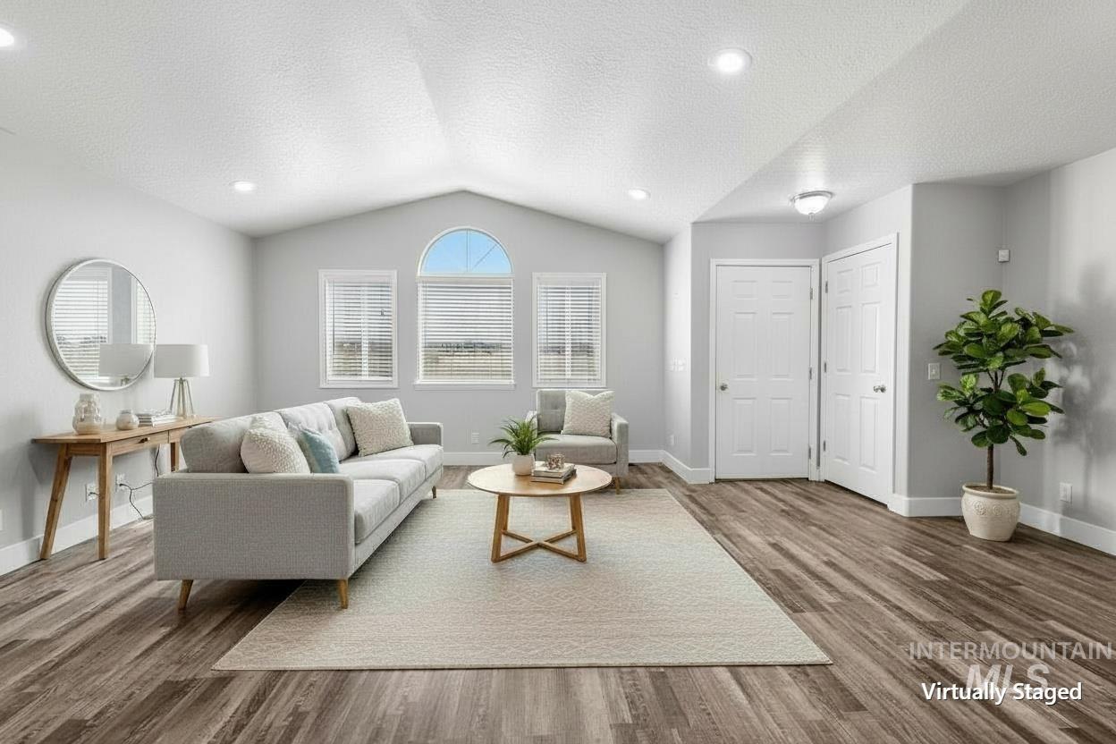 Vaulted ceiling featuring recessed lighting