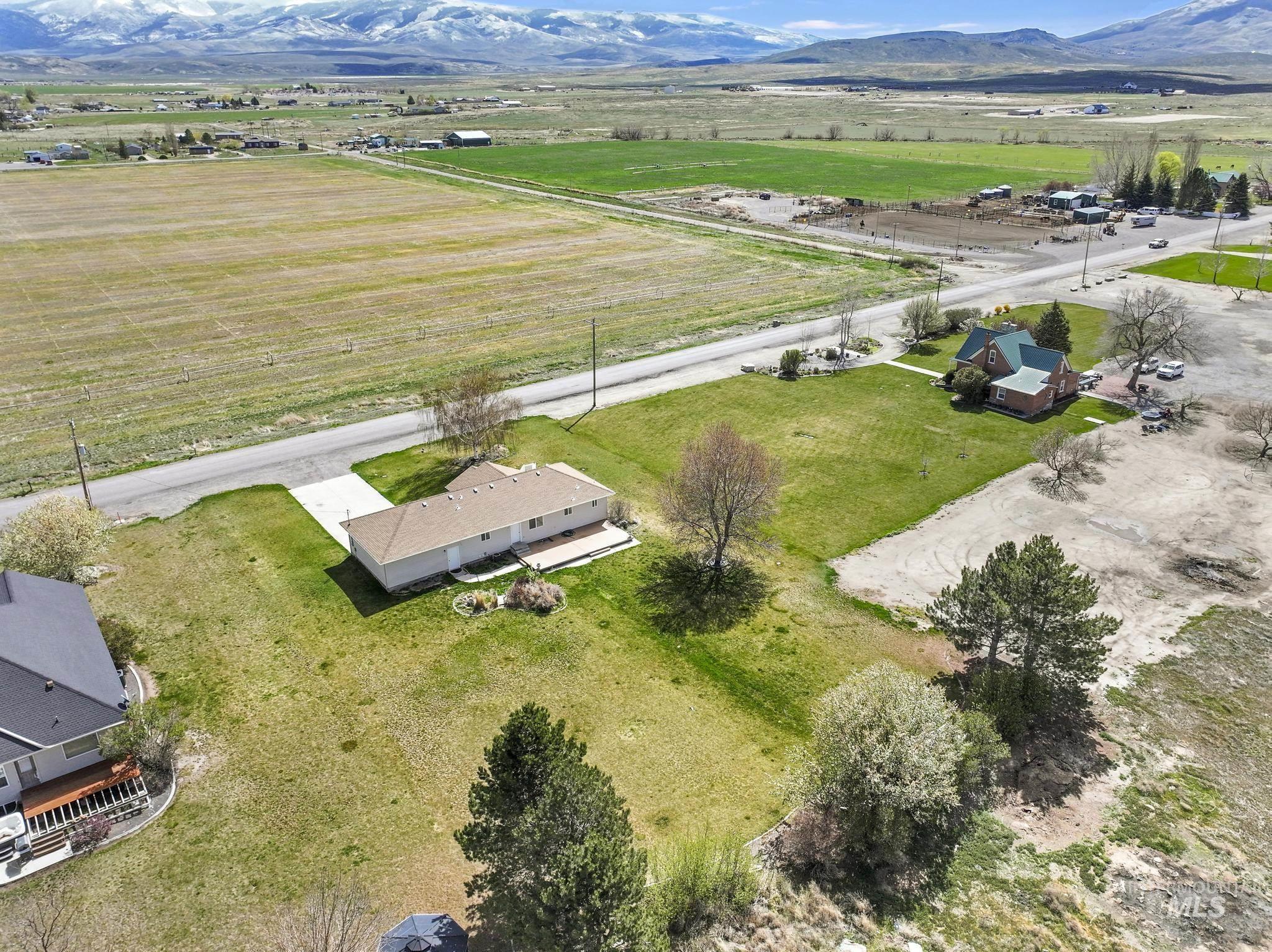Aerial view of sparsely populated area featuring a mountainous background
