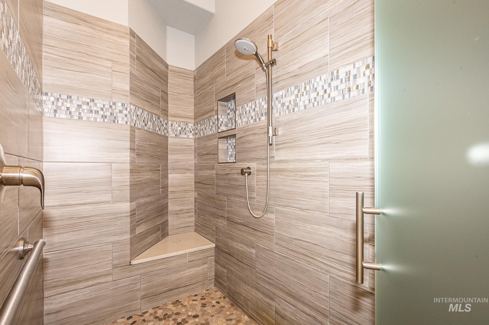 Full bathroom with a tile shower