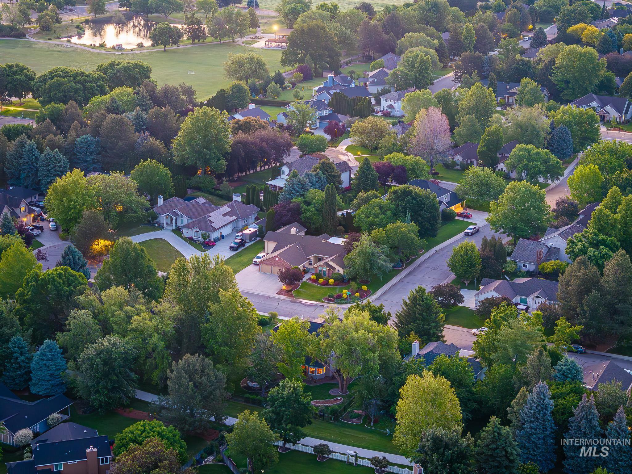 Aerial view of residential area featuring a golf course