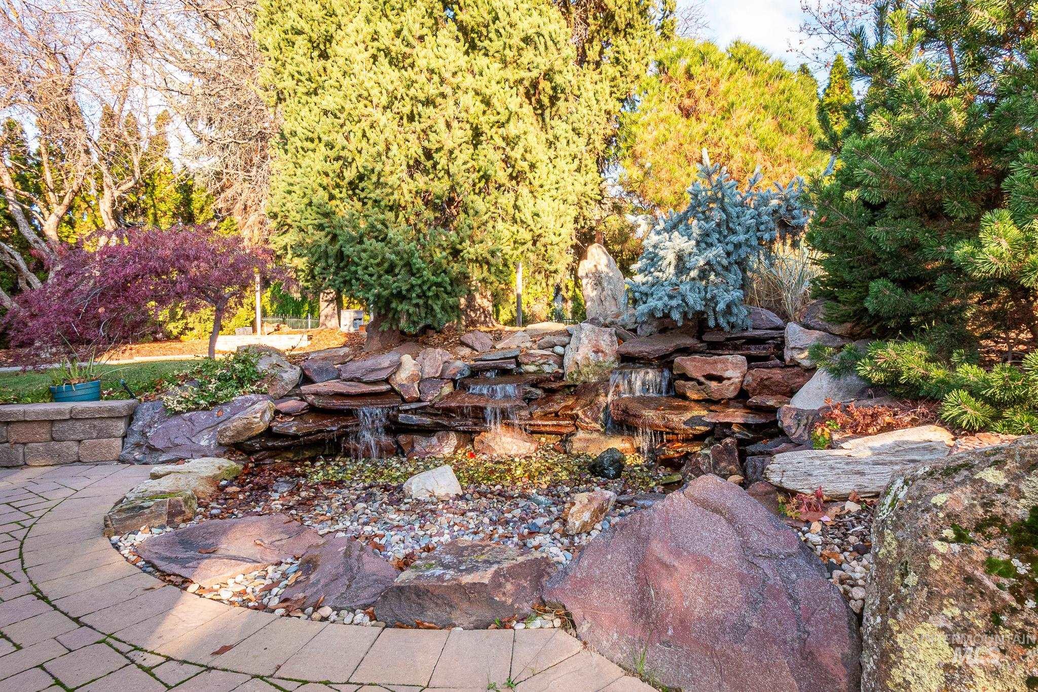 View of patio featuring a small pond