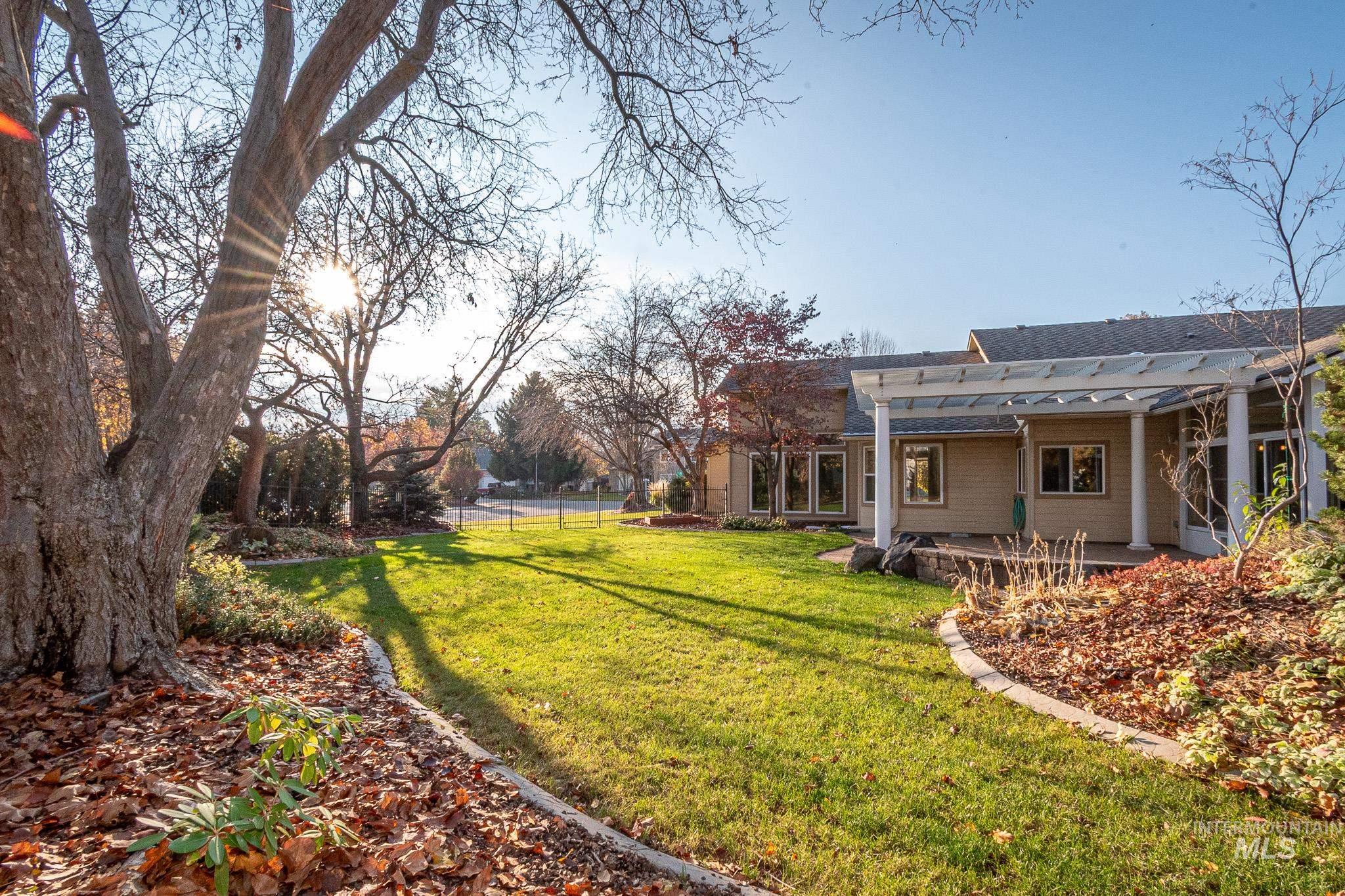 View of yard with a patio area and a pergola