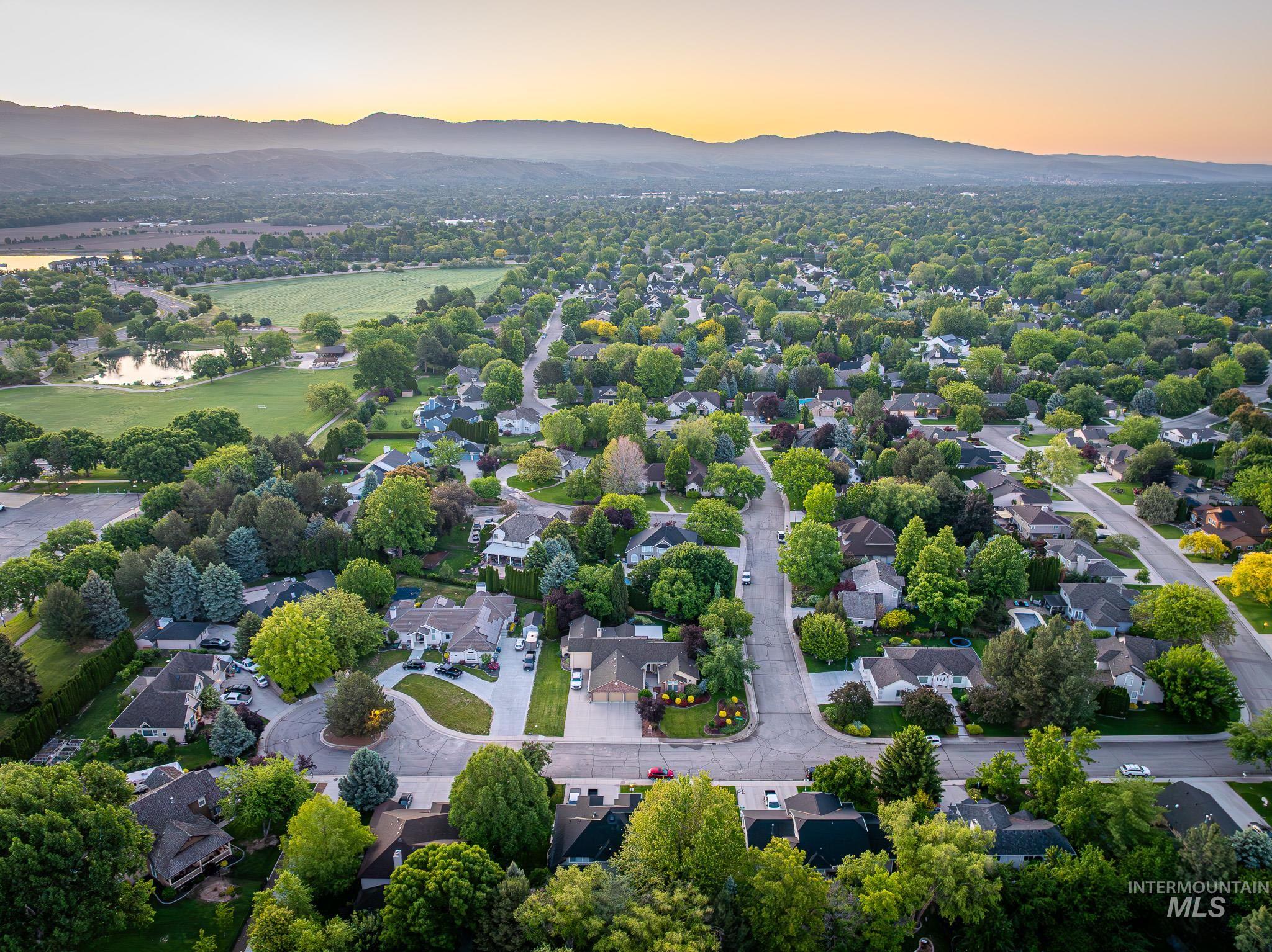 Aerial view at dusk of a residential view and a mountain view