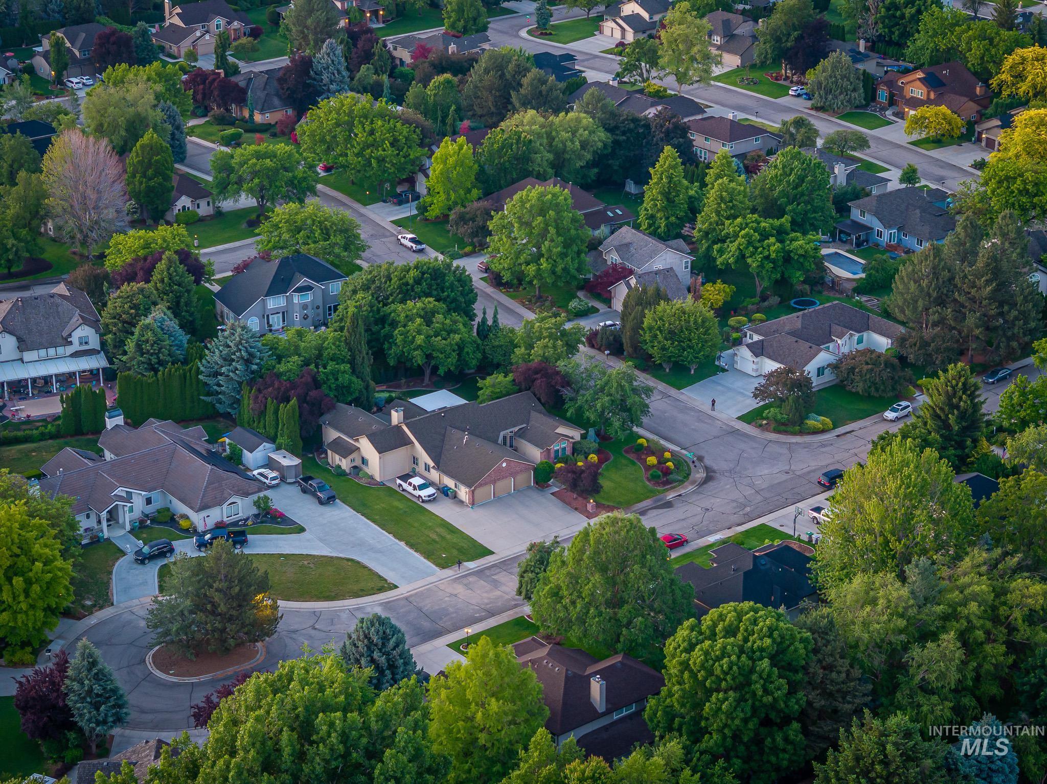 Aerial view of property's location featuring nearby suburban area
