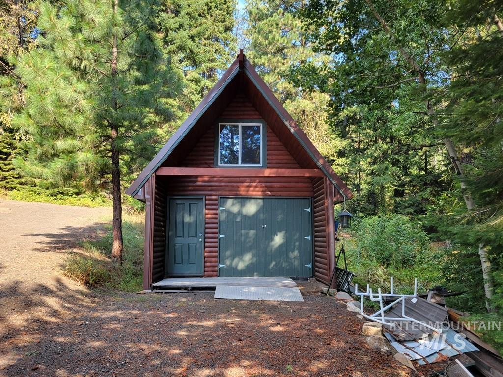 Garage with a view of trees