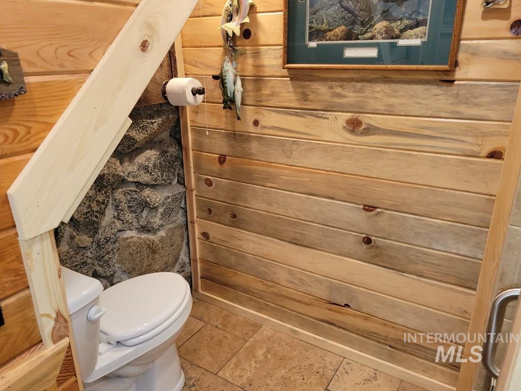 Bathroom featuring toilet and tile patterned floors