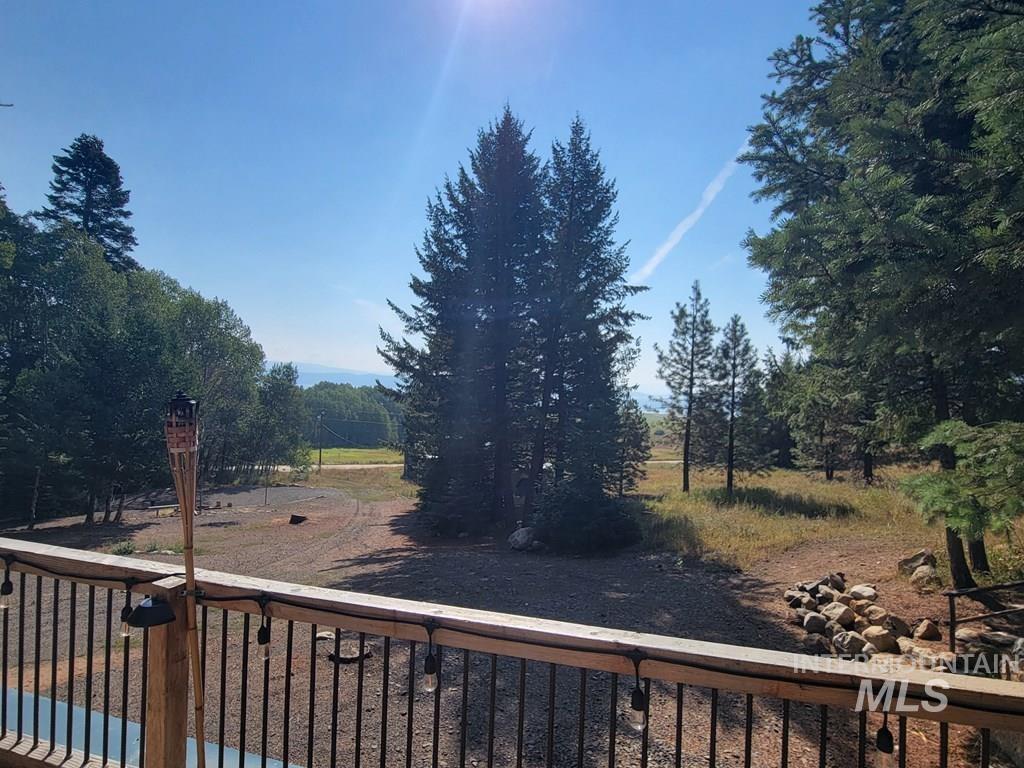View of yard with a balcony