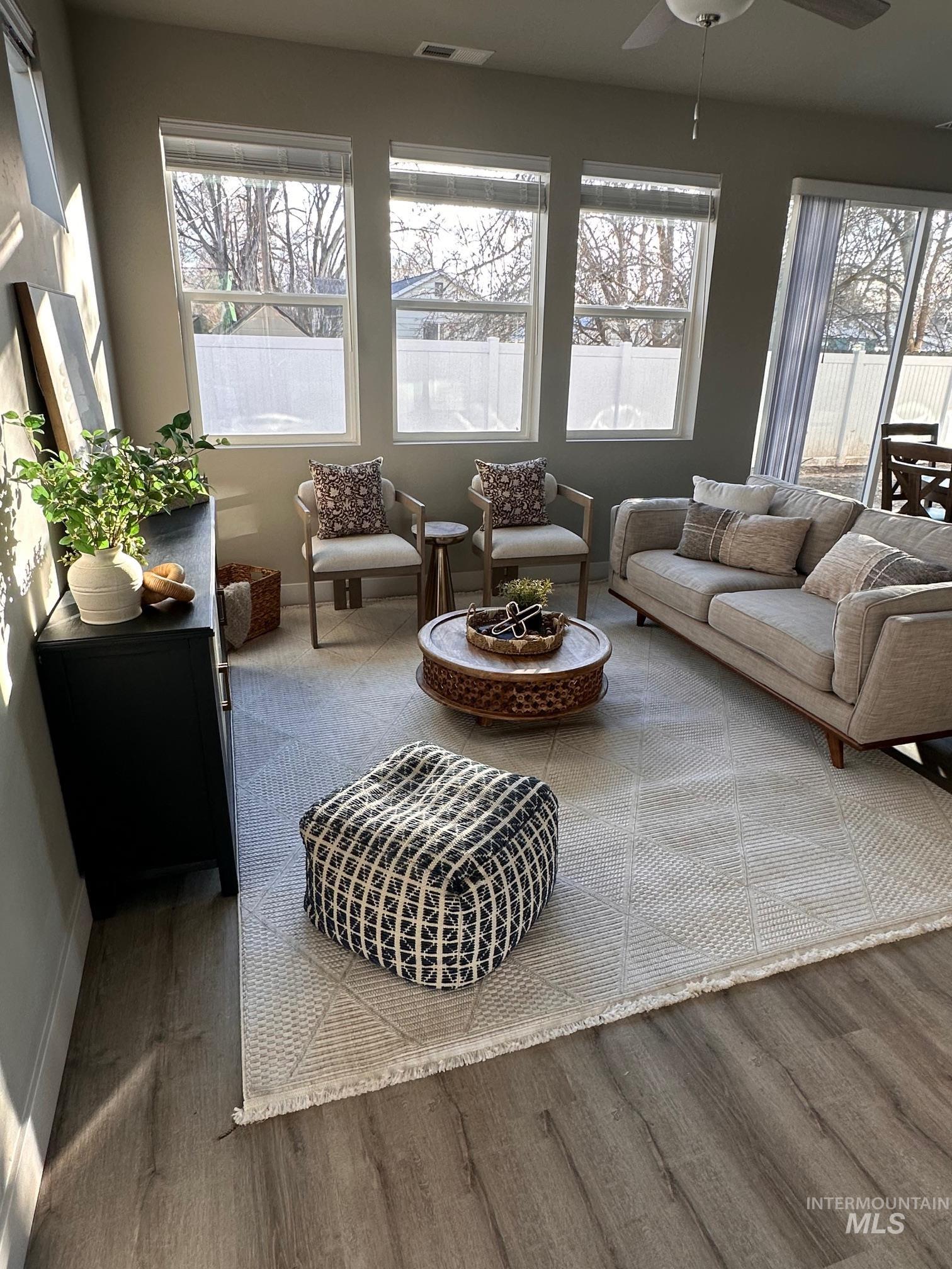 Sunroom featuring plenty of natural light