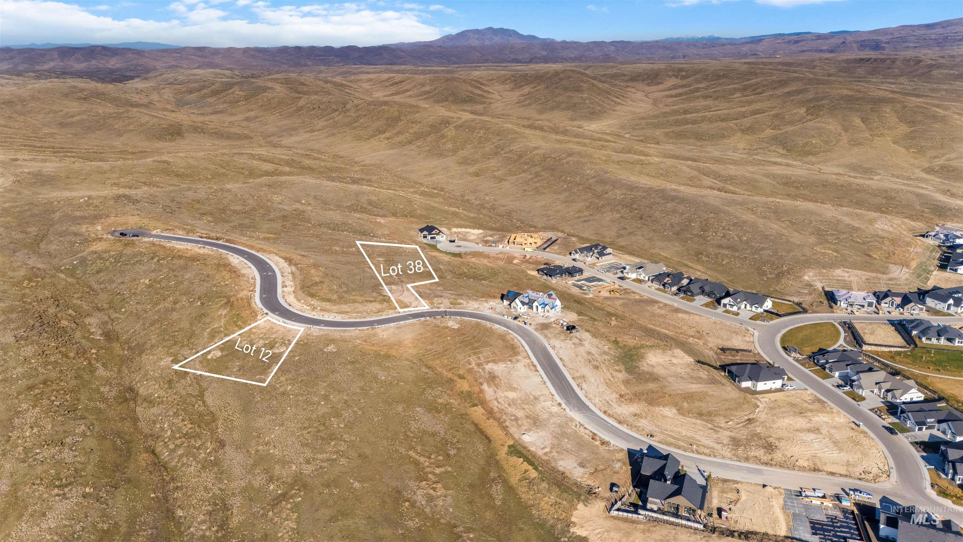 Aerial view of property's location with a mountainous background and rural landscape