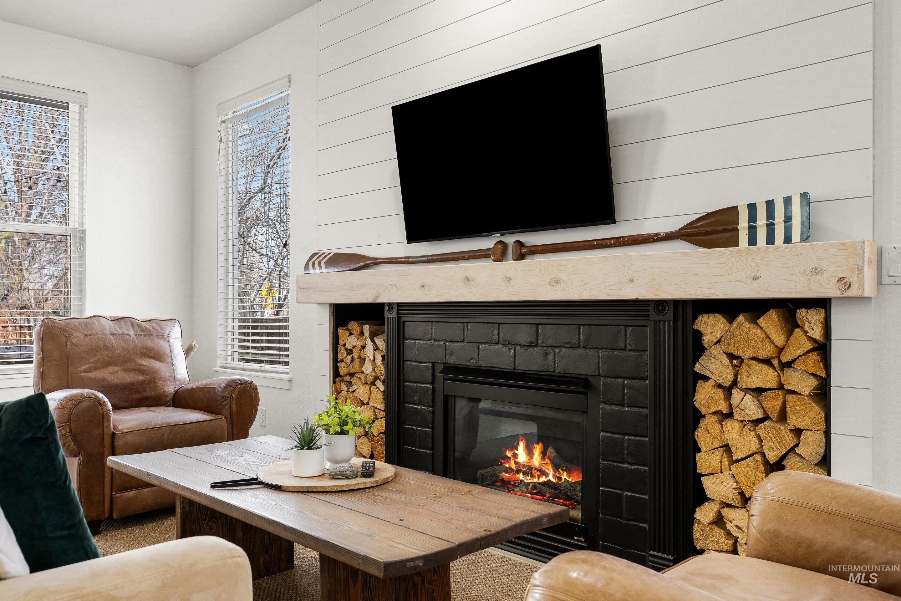 Living area featuring a glass covered fireplace