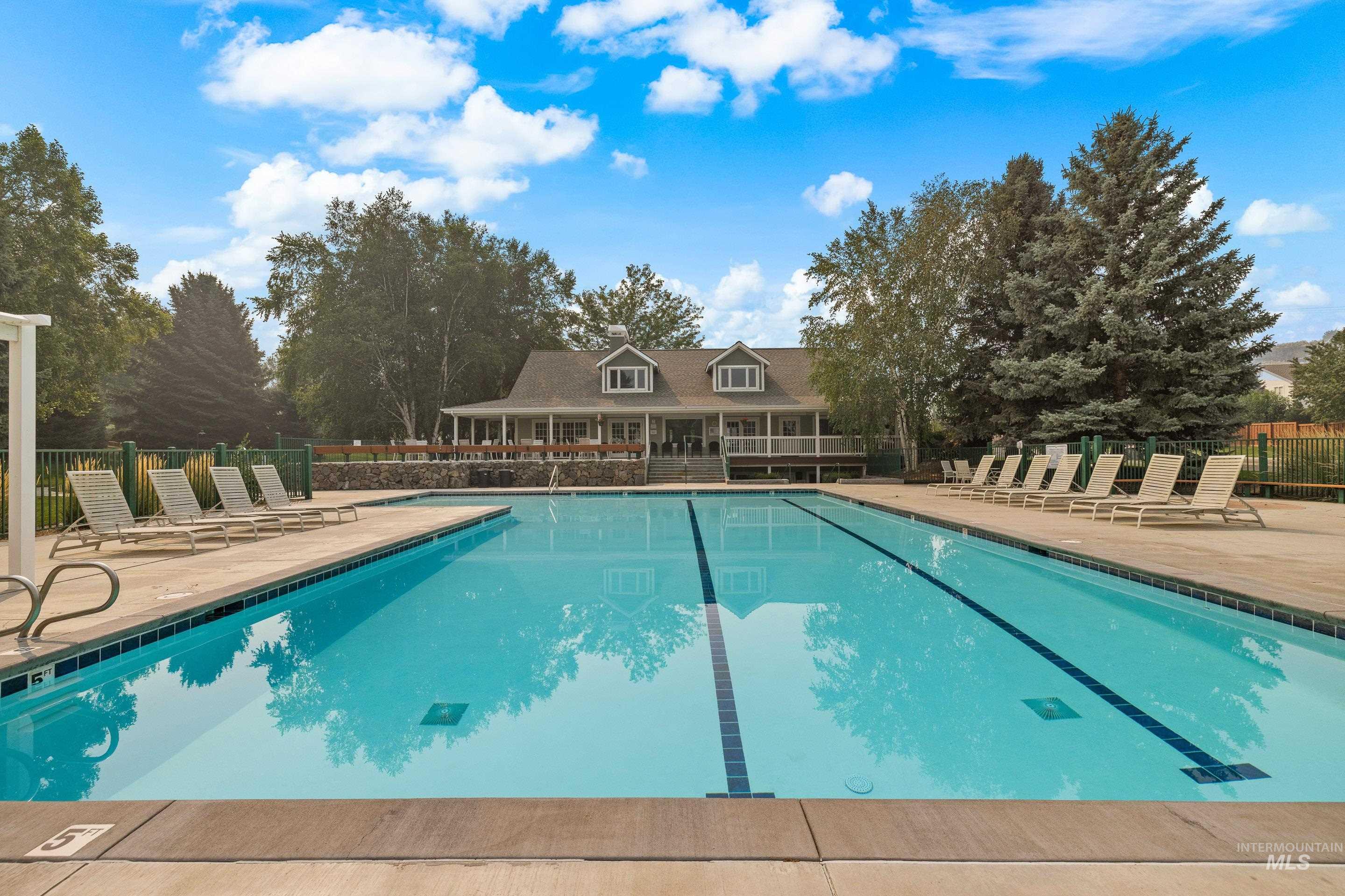 Community pool featuring a patio