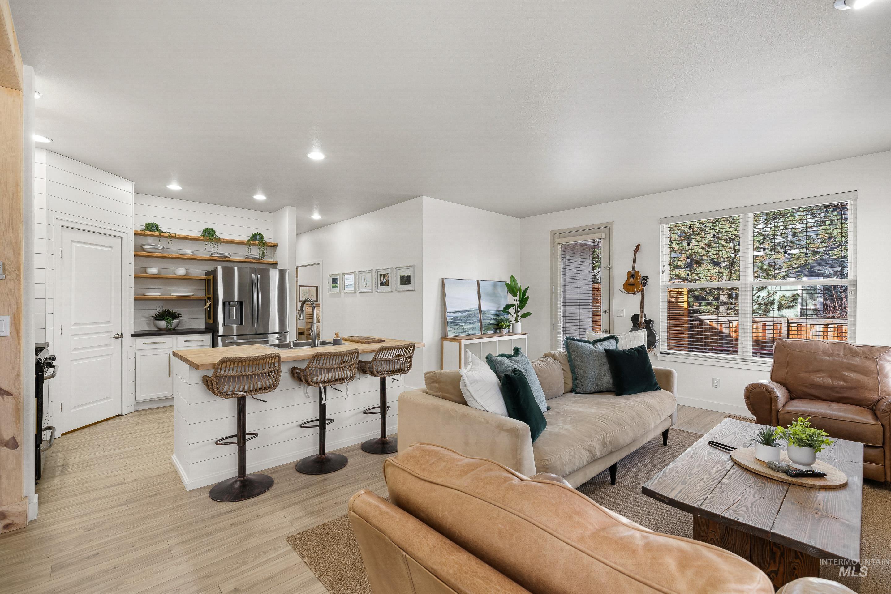 Living area featuring recessed lighting and light wood-style flooring