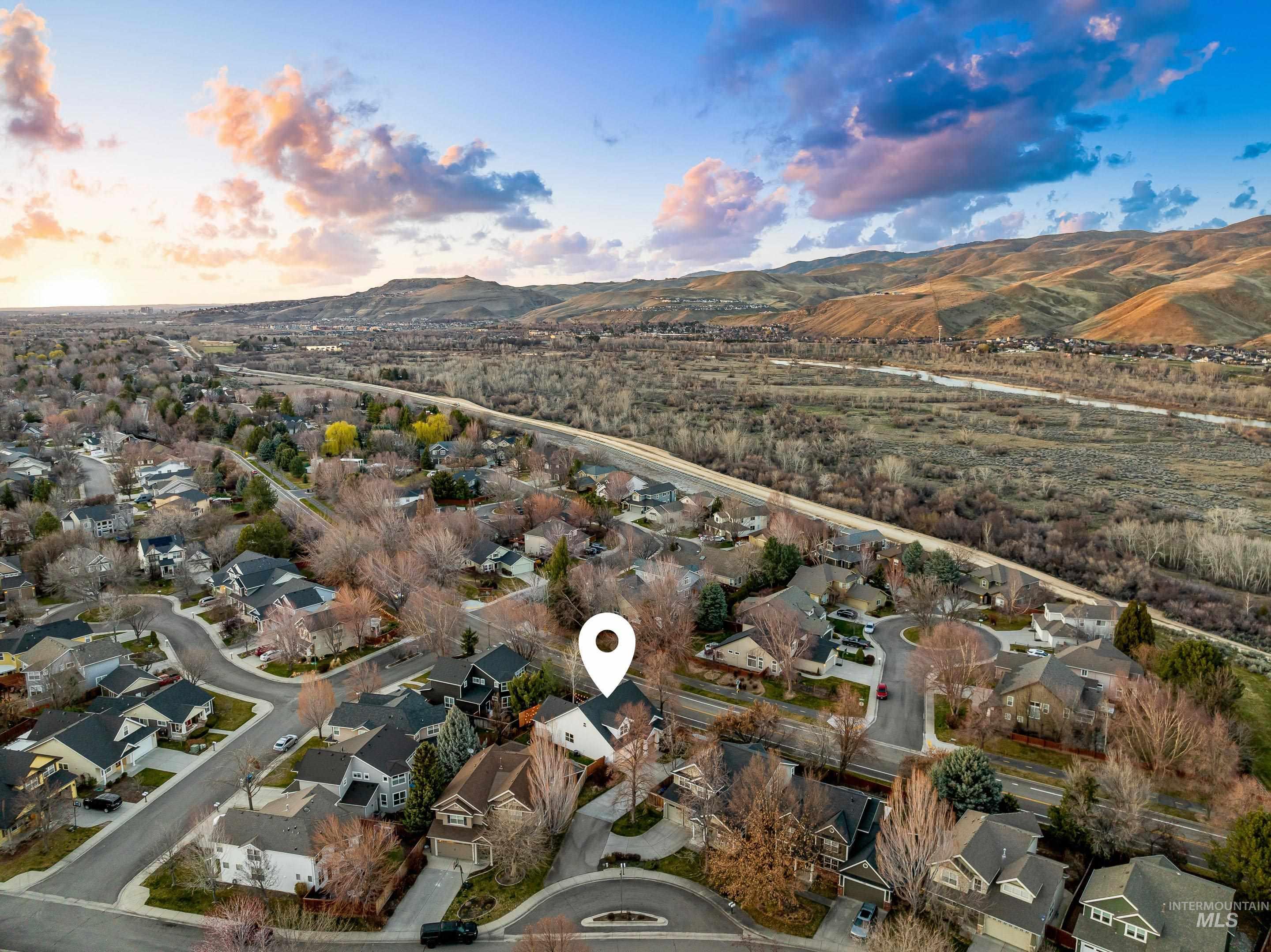 Aerial view at dusk of a residential view and a mountain view