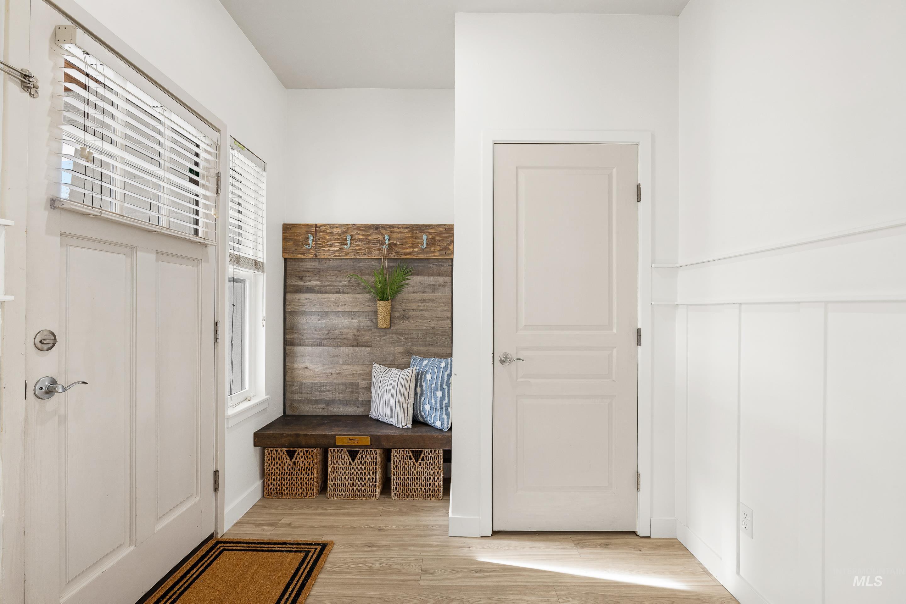 Mudroom featuring light wood-style flooring