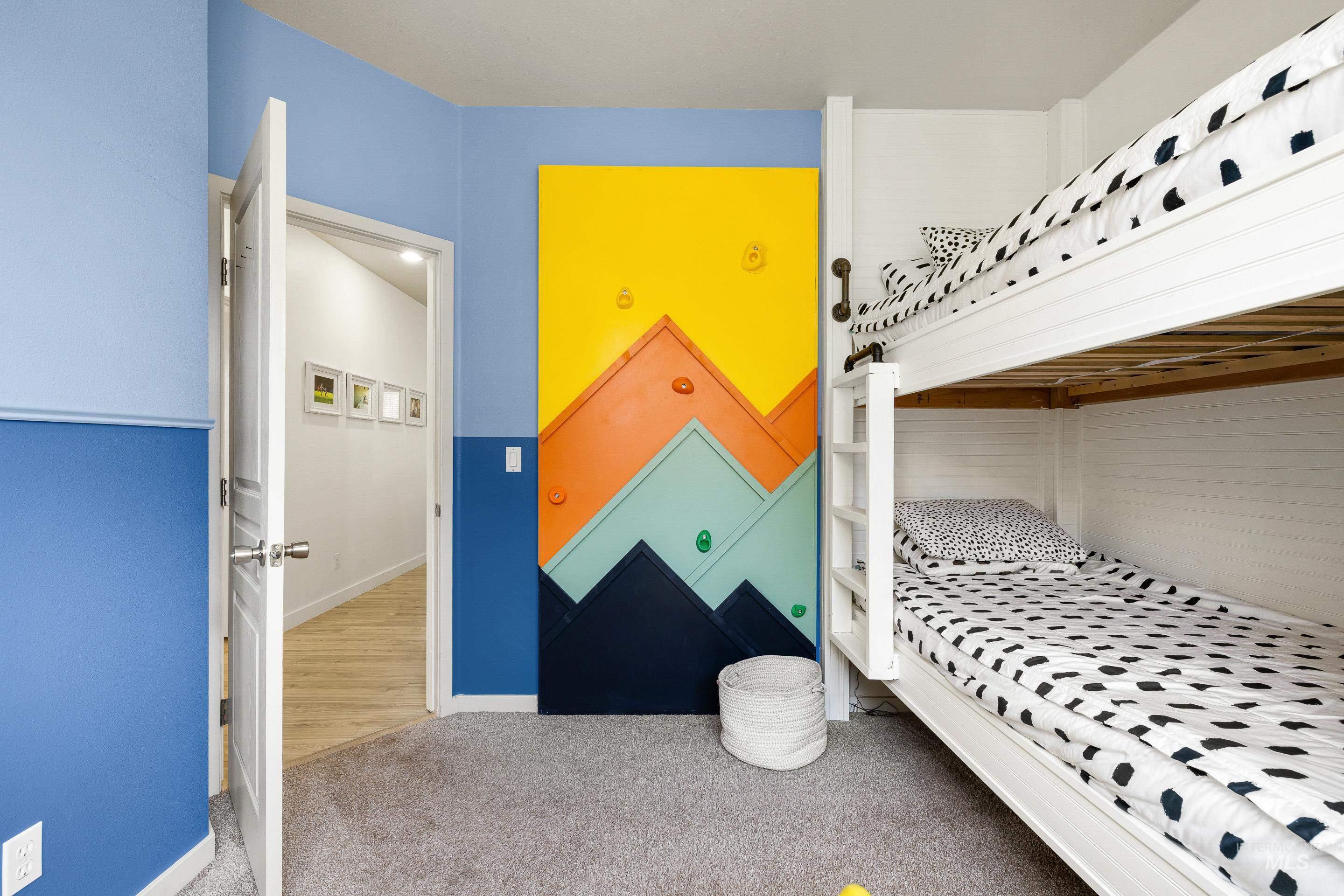 Carpeted bedroom with baseboards