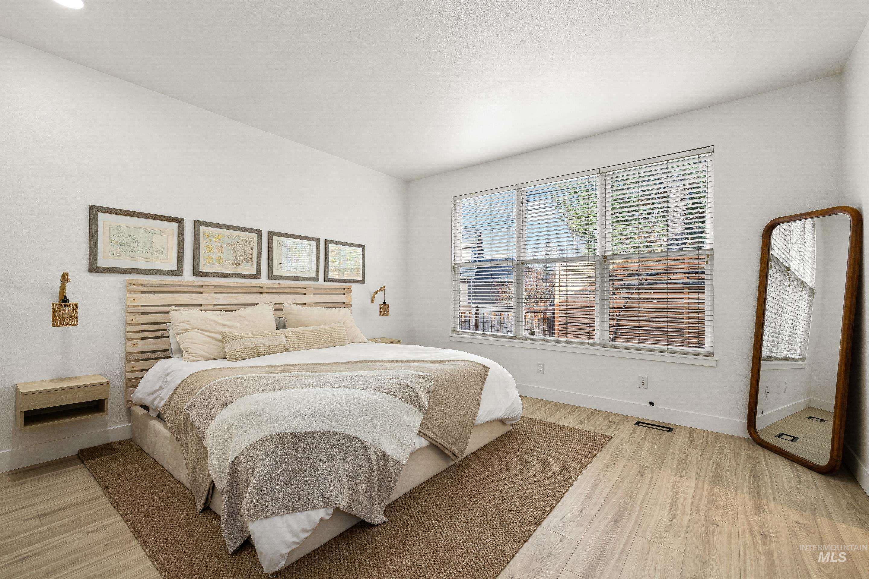 Bedroom featuring baseboards and light wood-style flooring