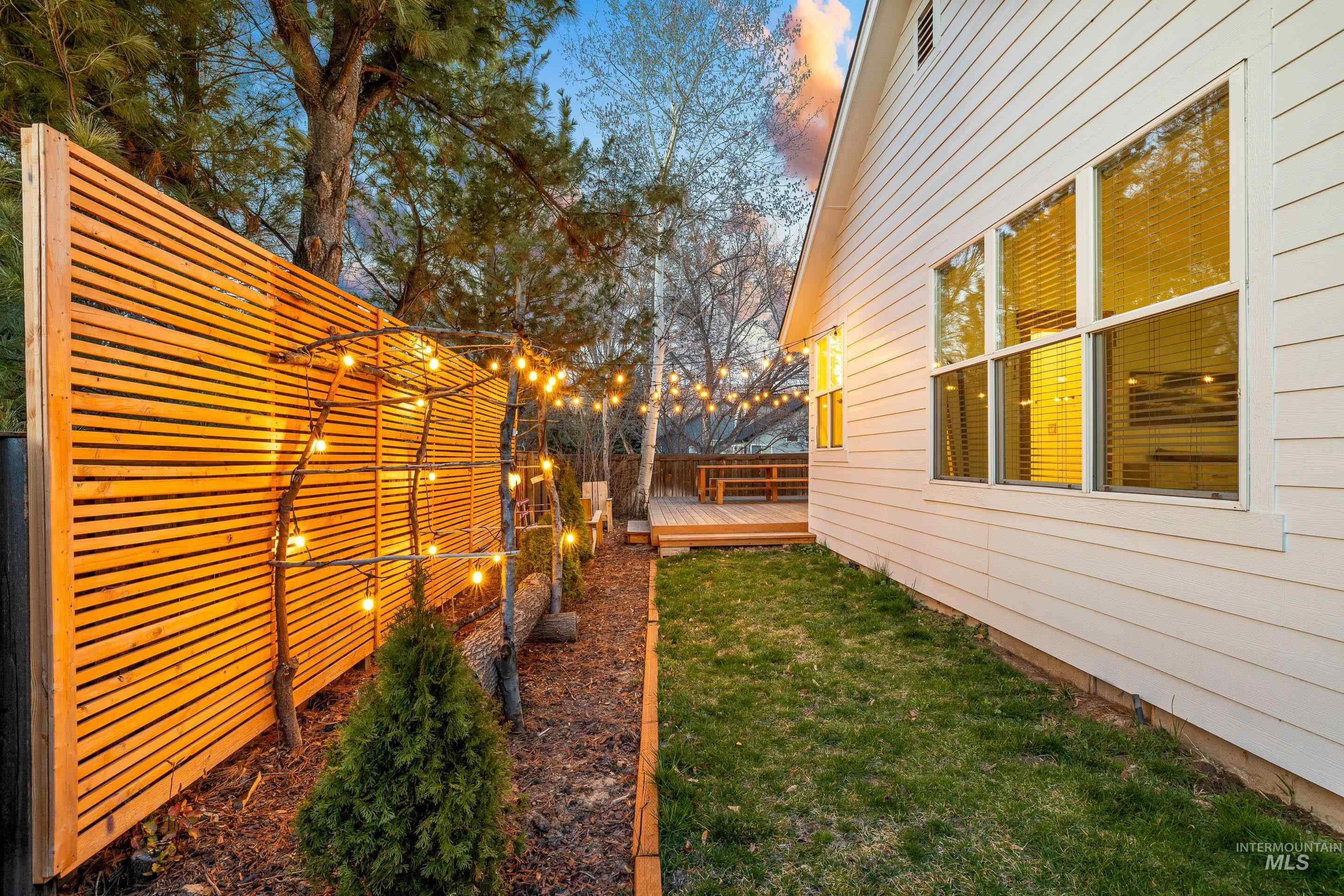 Fenced yard with a deck