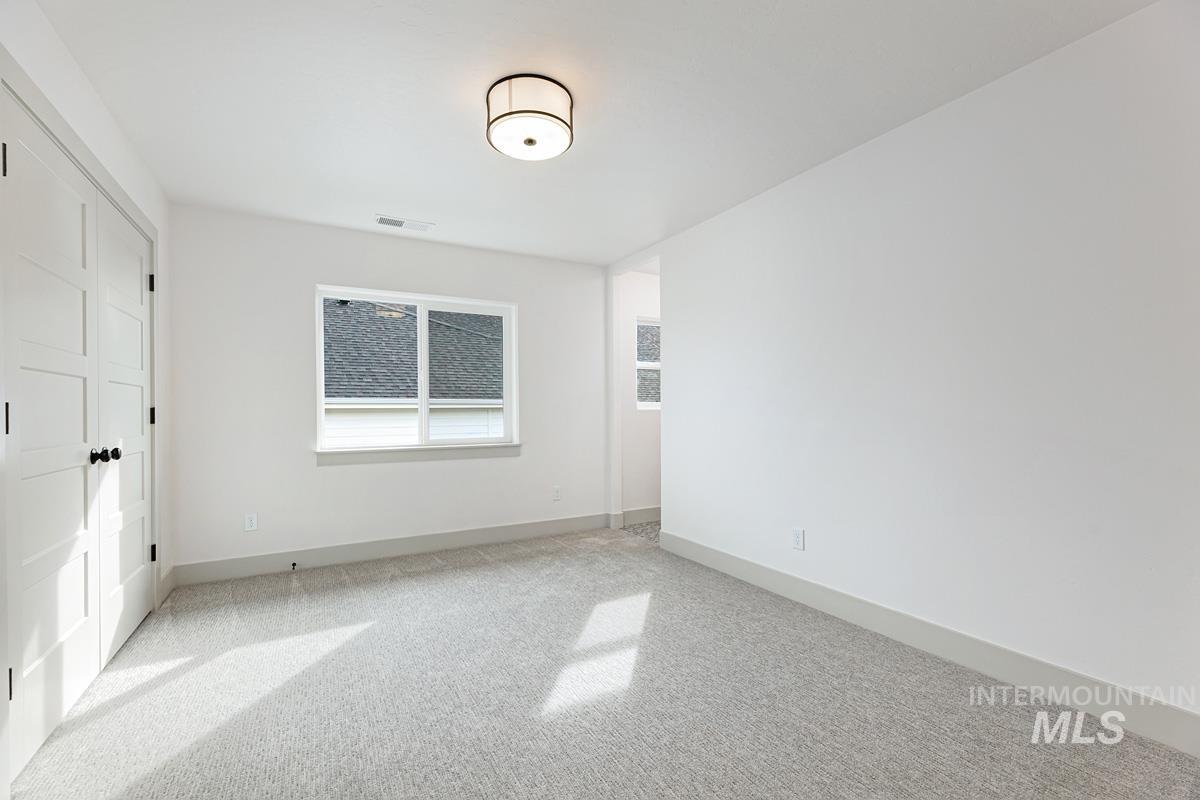 Unfurnished bedroom with a closet and carpet flooring