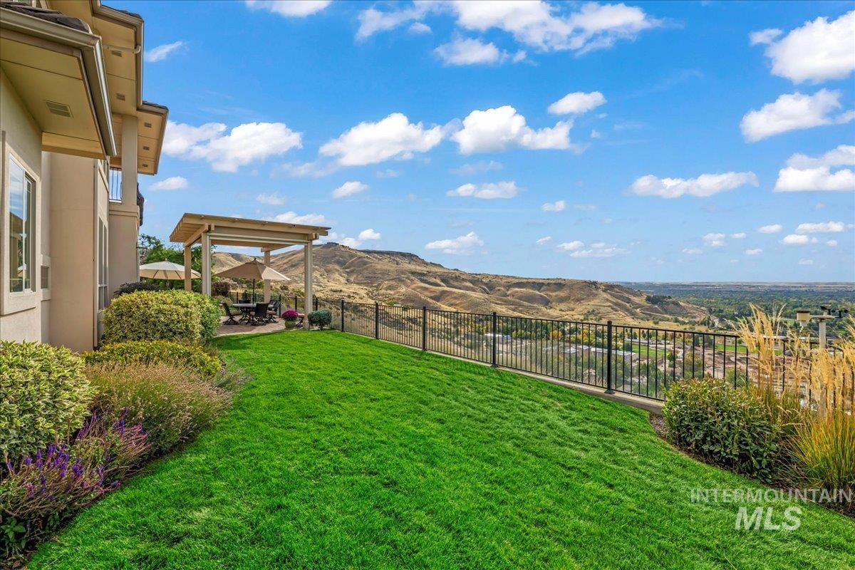 View of yard featuring a patio and a mountain view