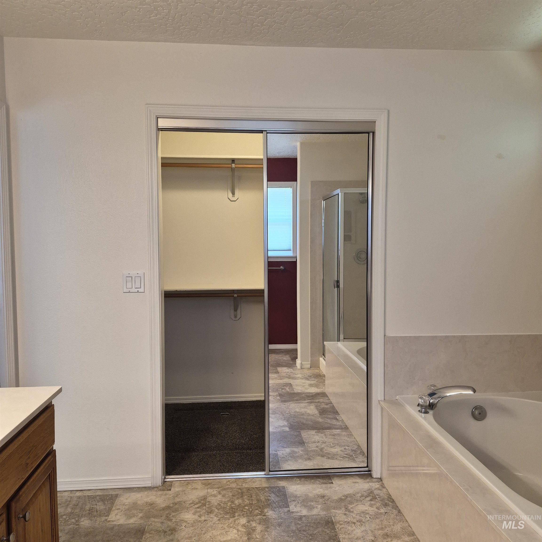 Walk-in closet and soaker tub