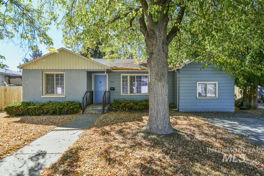 Single story home featuring brick siding