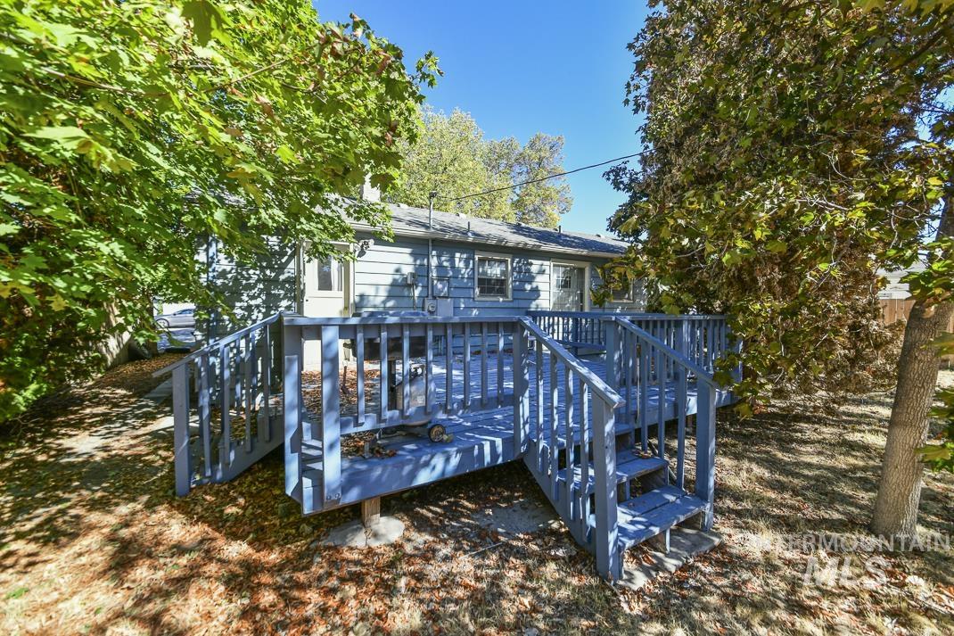 Rear view of property featuring a deck