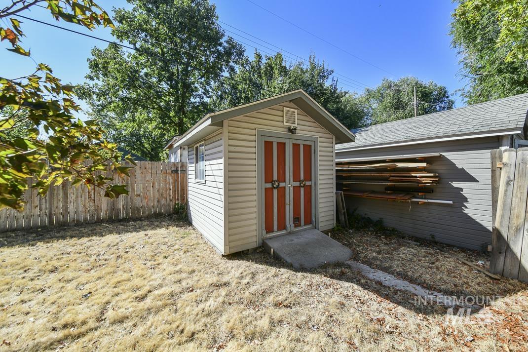 View of shed featuring a fenced backyard