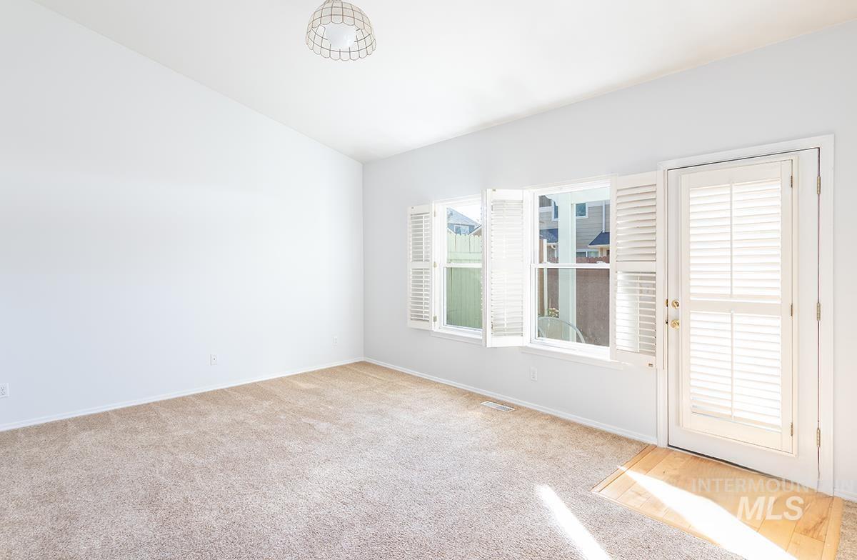 Unfurnished room with carpet floors and baseboards