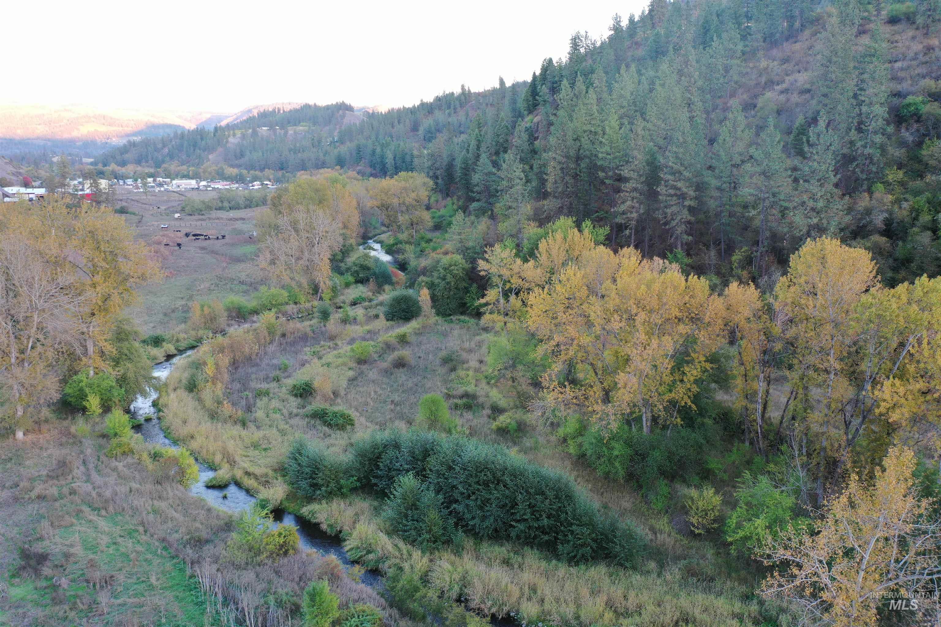 Aerial view of property's location with a mountainous background