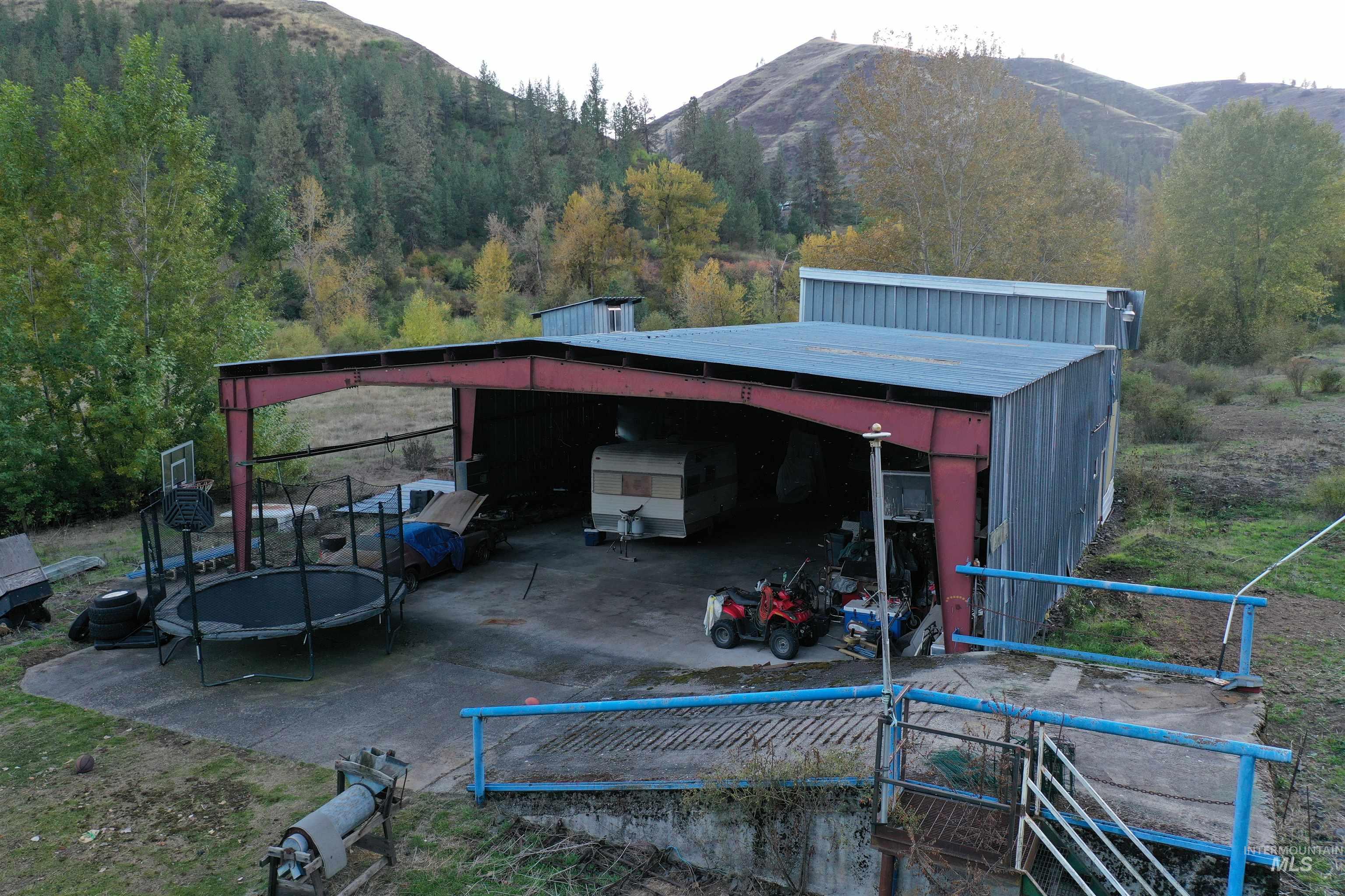 View of outbuilding with a trampoline and a mountain view
