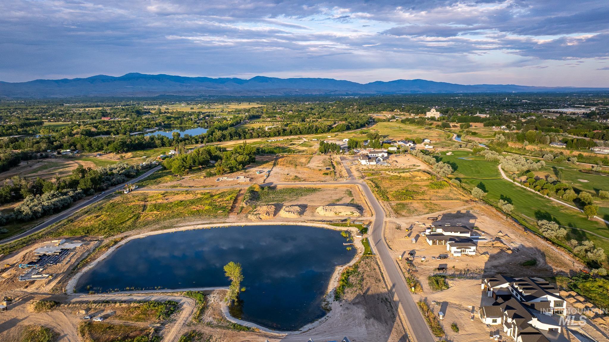View of property location with a water and mountain view