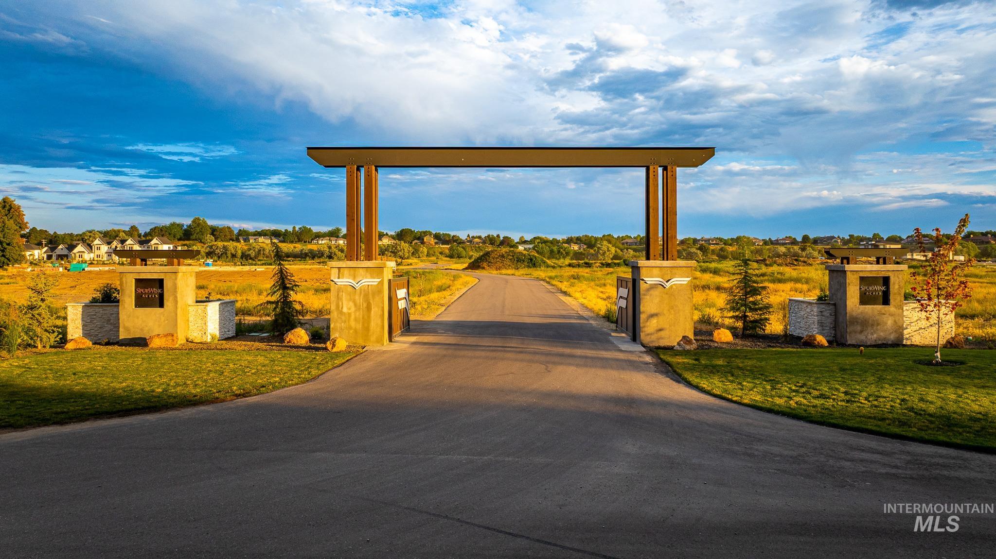 View of home's community with a gate