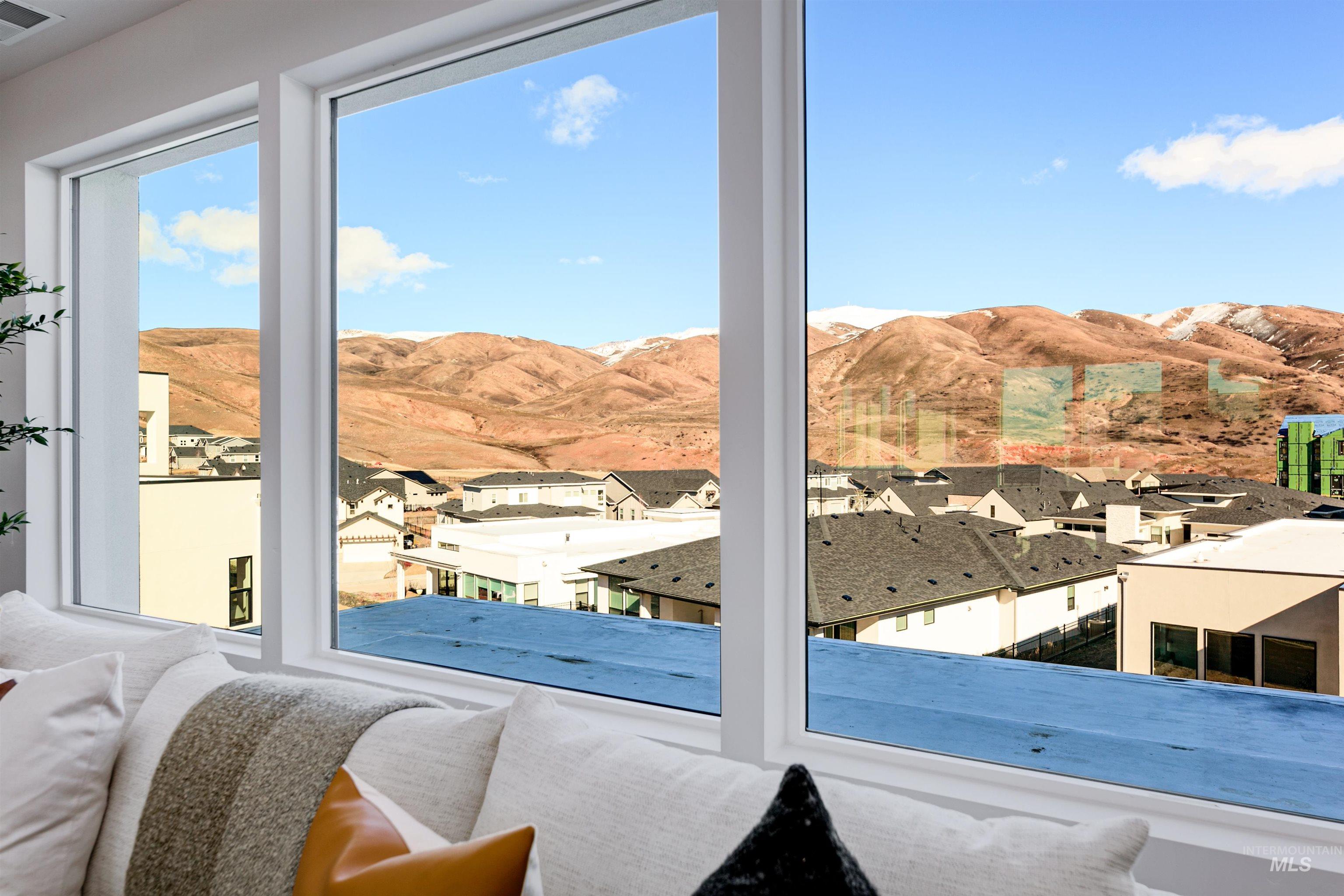 Doorway to outside with a mountain view and a residential view