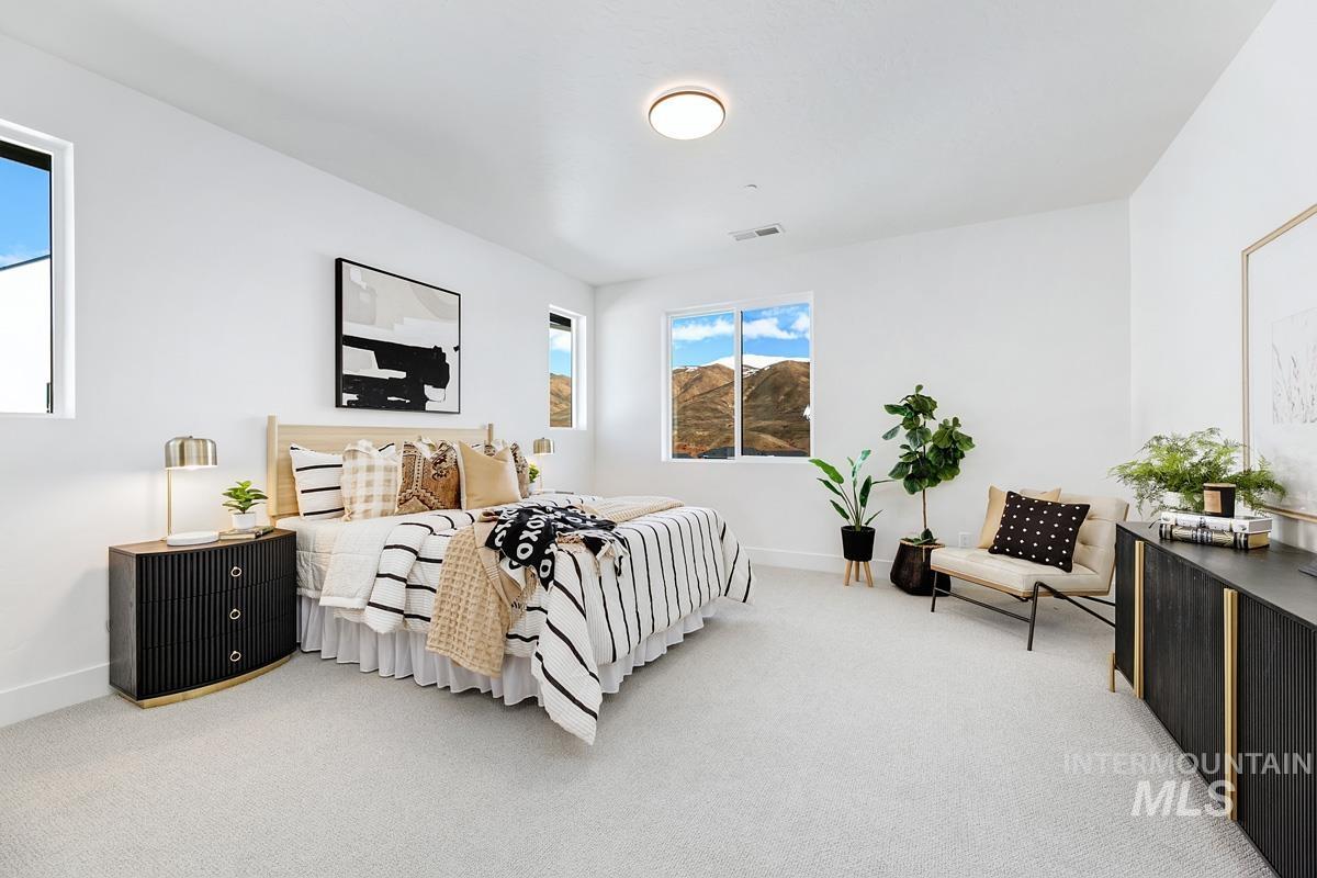 Bedroom with carpet and baseboards