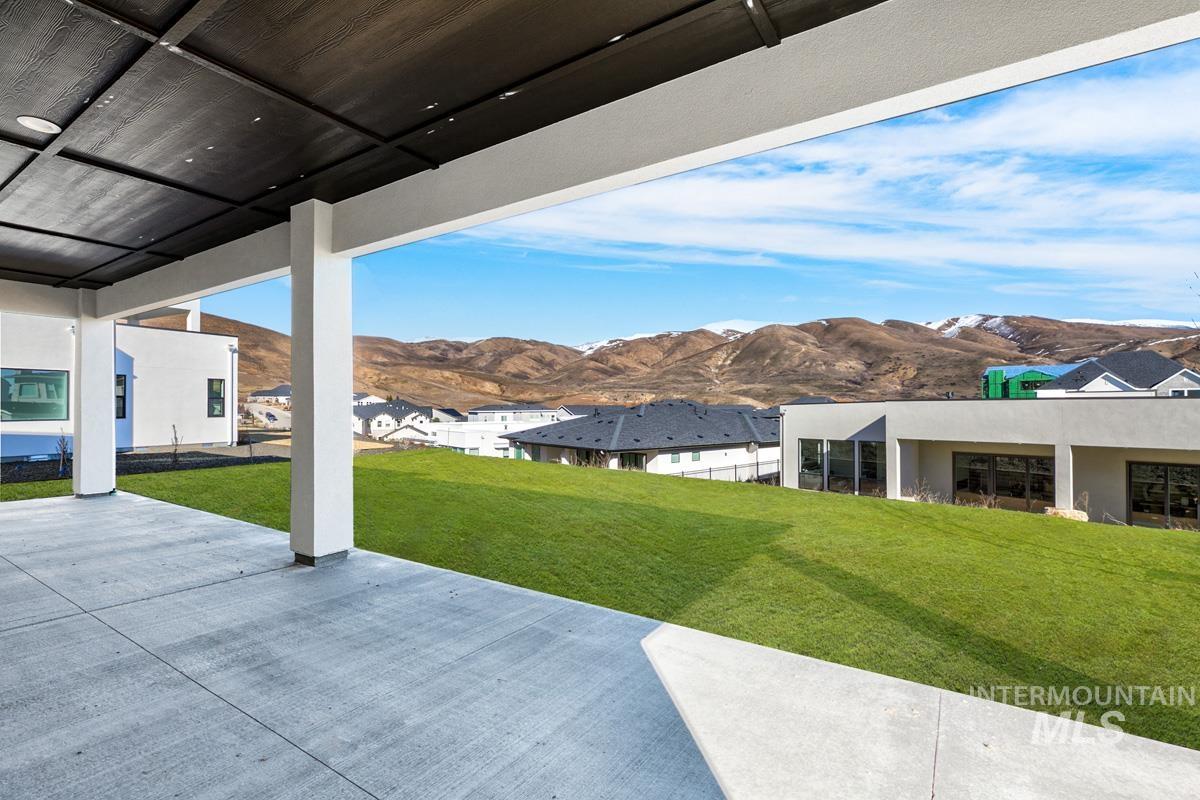 View of patio with a mountain view and a residential view