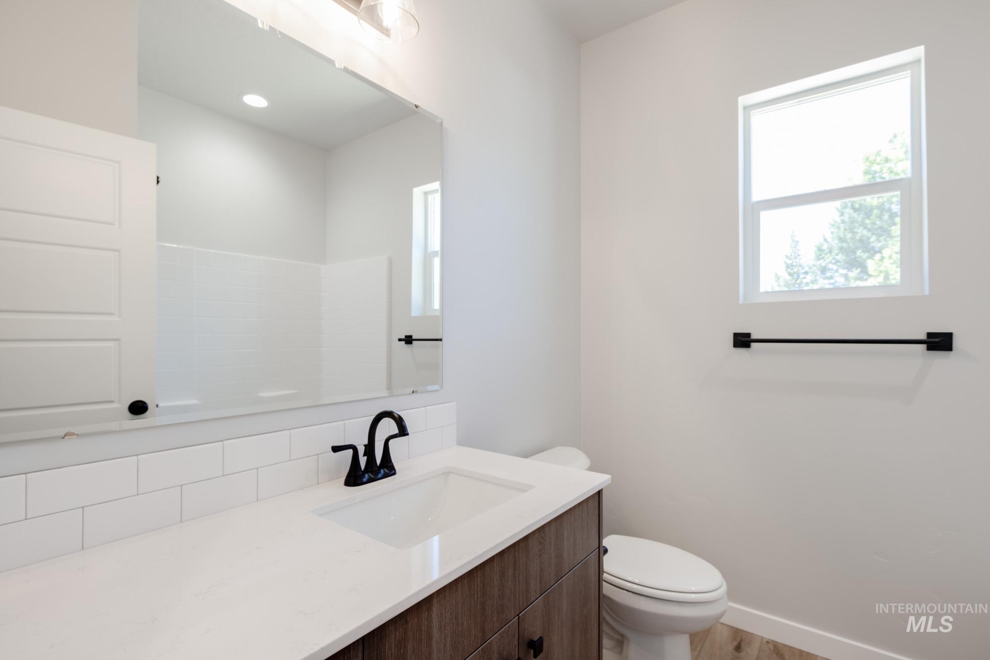 Bathroom featuring vanity and light wood-style flooring
